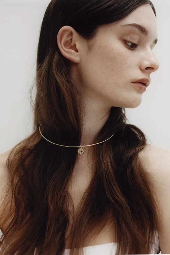 	
Close-up of a woman's face with long, natural textured wavy hair style by Domenico Sansone at The Six, Mayfair.