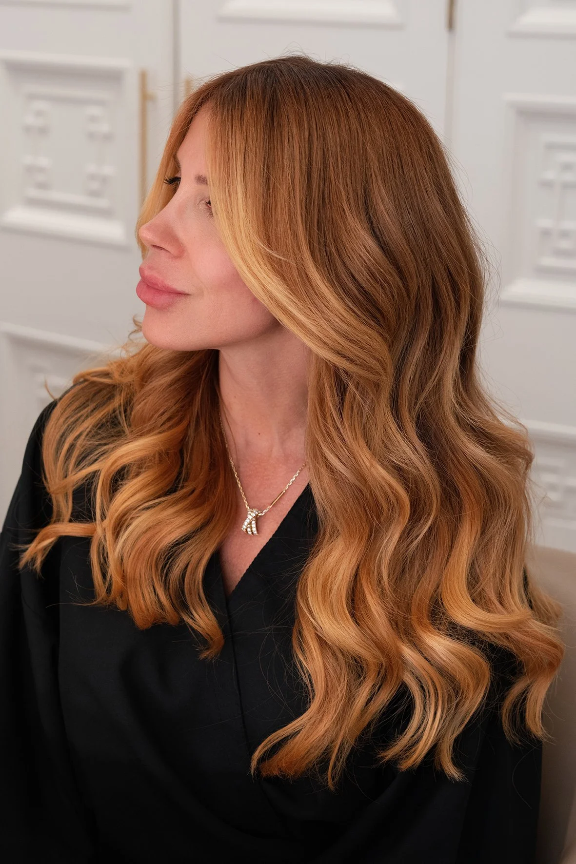 warm light blonde face framing balayage and a rich medium warm base colour. soft wave blow dry by Dani Caldeira.