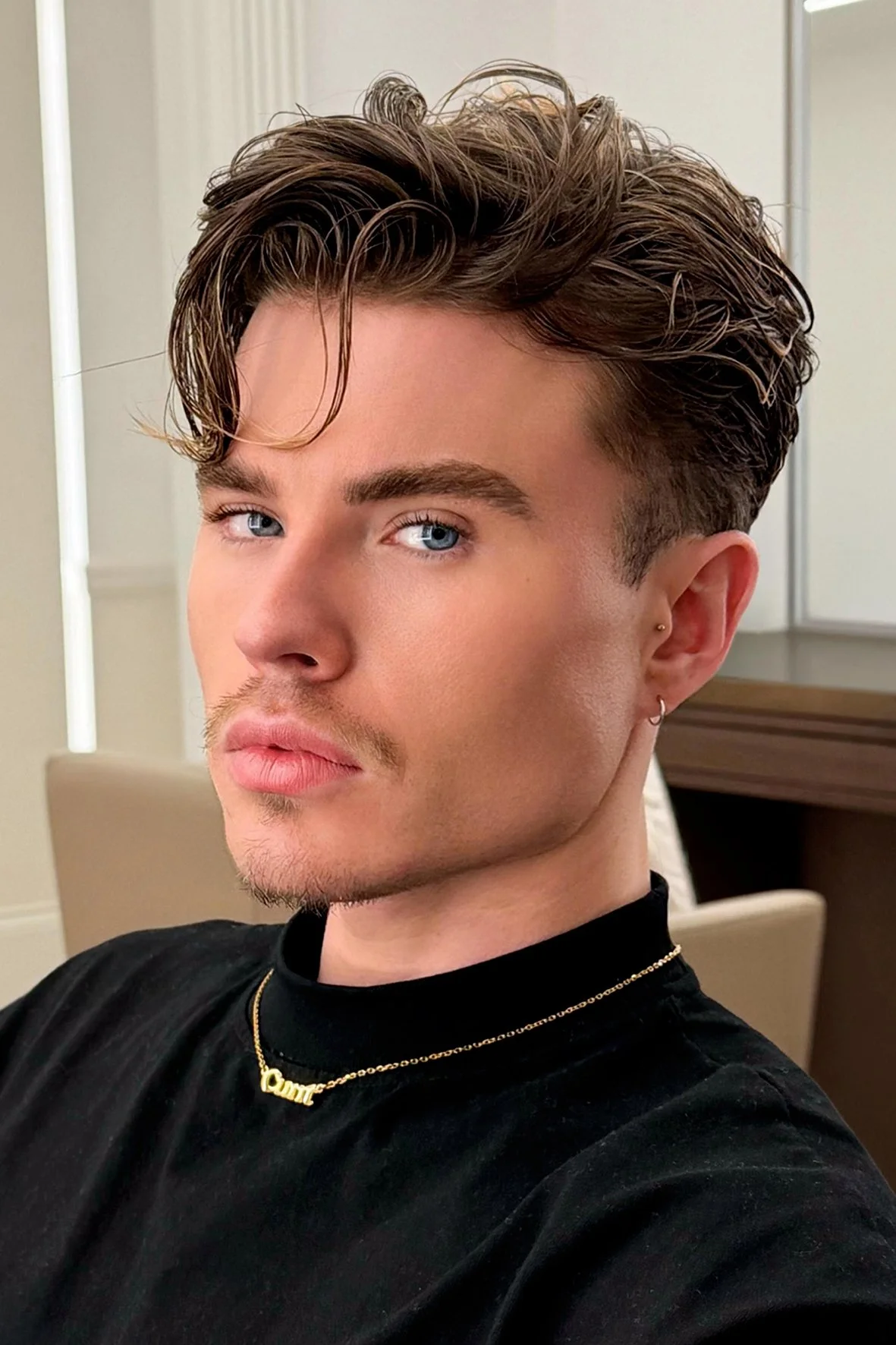 gent's cut, long natural movement on the top and soft fading on the side by Milad.