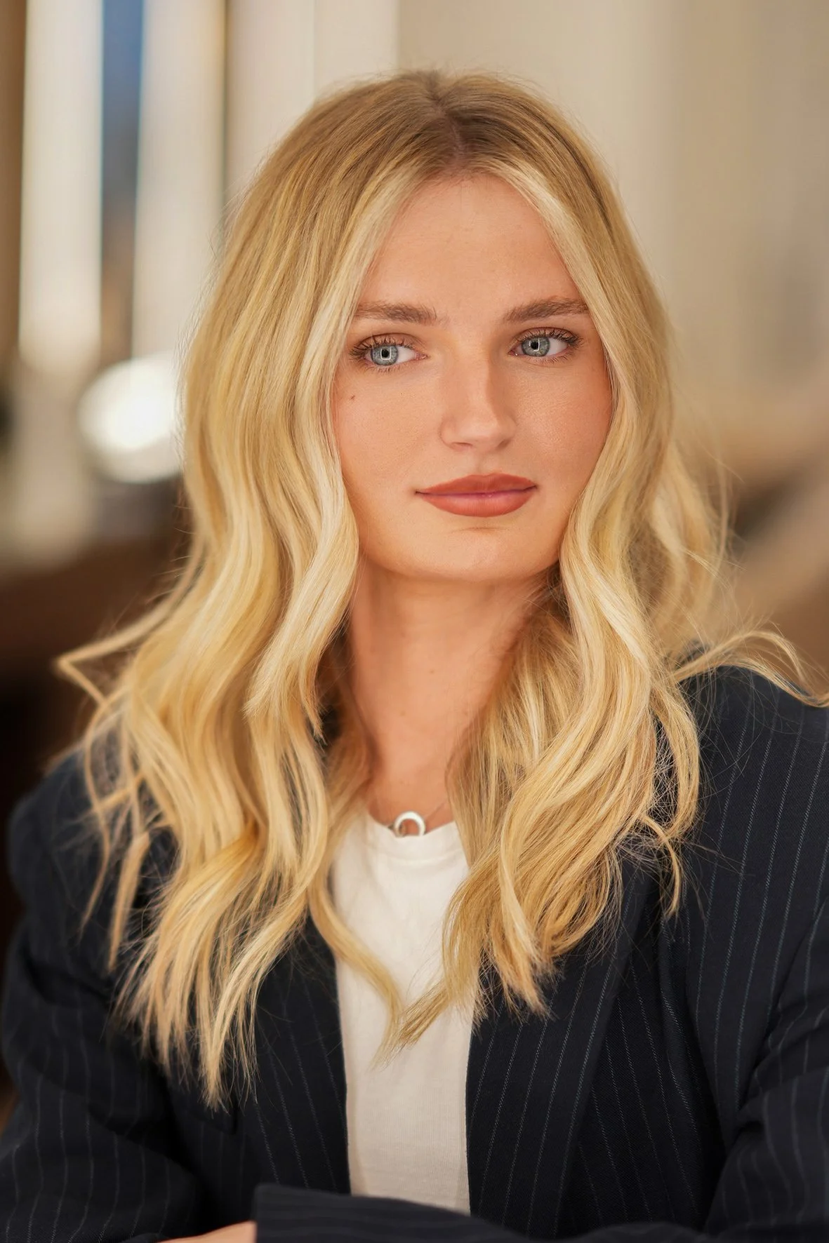 beach waves styling with sun kissed blonde balayage by Marcos Verissimo.