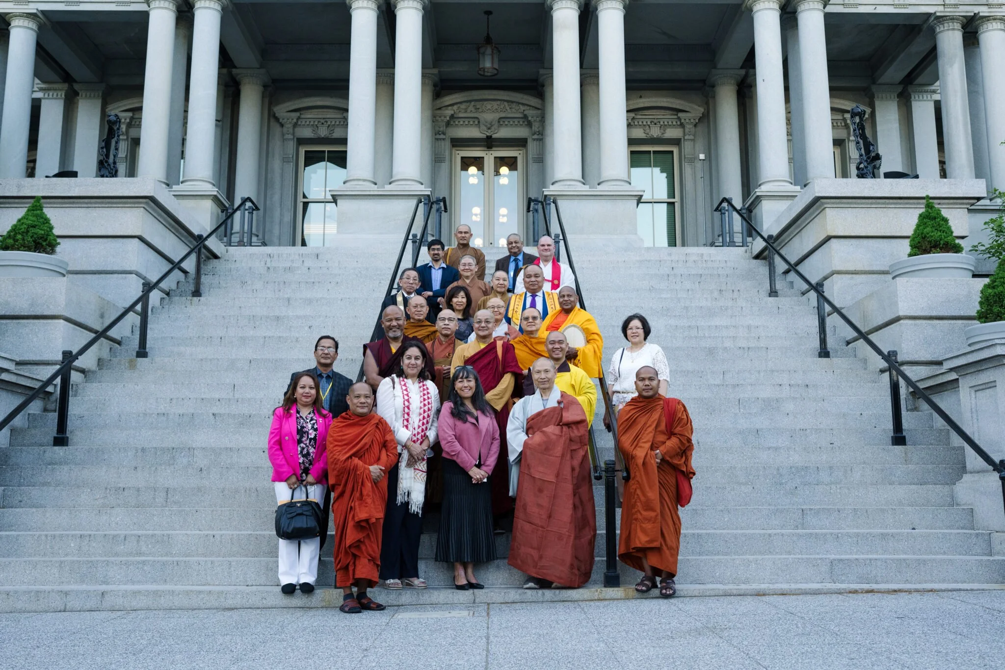 IBAA-monastic-and-lay-leaders-meeting-with-WHFO-official-Jennifer-Korn-in-front-of-the-Eisenhower-Executive-Bldg.-in-the-White-House-complex-2048x1366.jpg