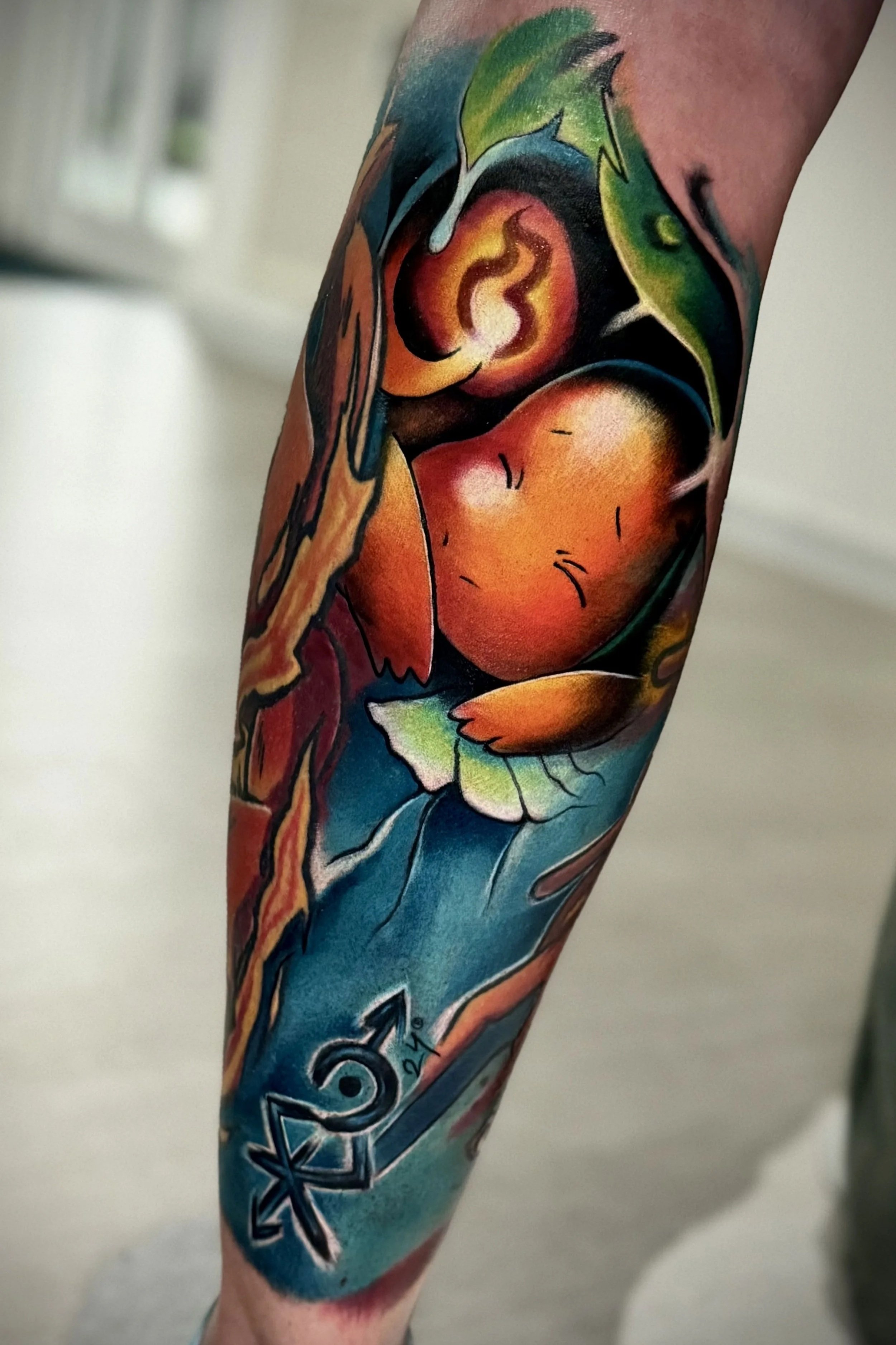 Color Tattoo von Glumanda aus Pokémon mit leuchtenden Farben auf dem Unterarm.