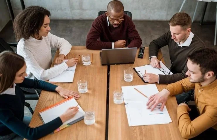 high-angle-people-table-office-meeting_23-2148817061.jpg