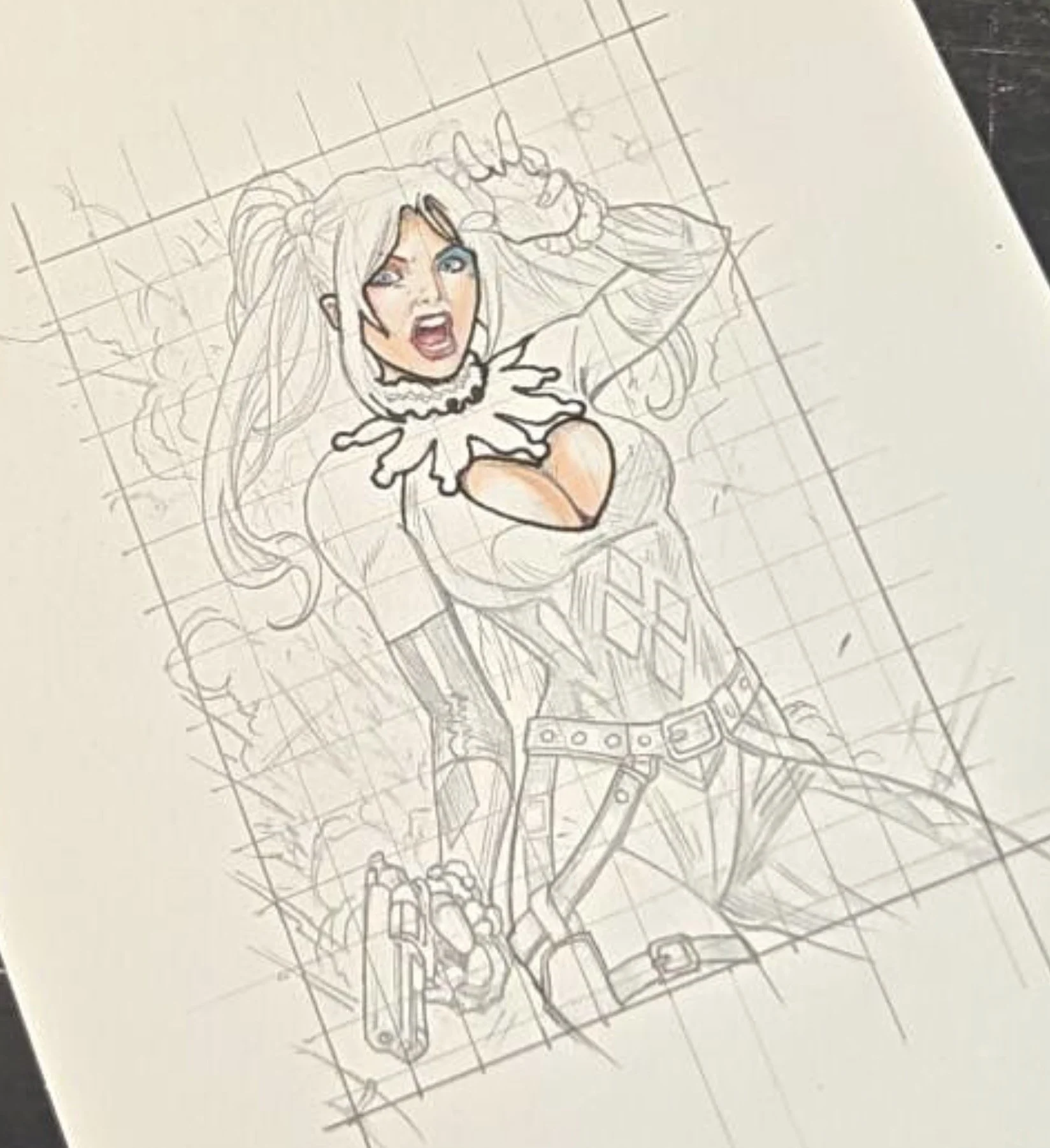 Harley Quinn sketch card by Javier. A sketch of a female character with long hair, wearing a costume with a collar and a belt, standing in a dynamic pose with her mouth open, one arm raised and the other at her side,