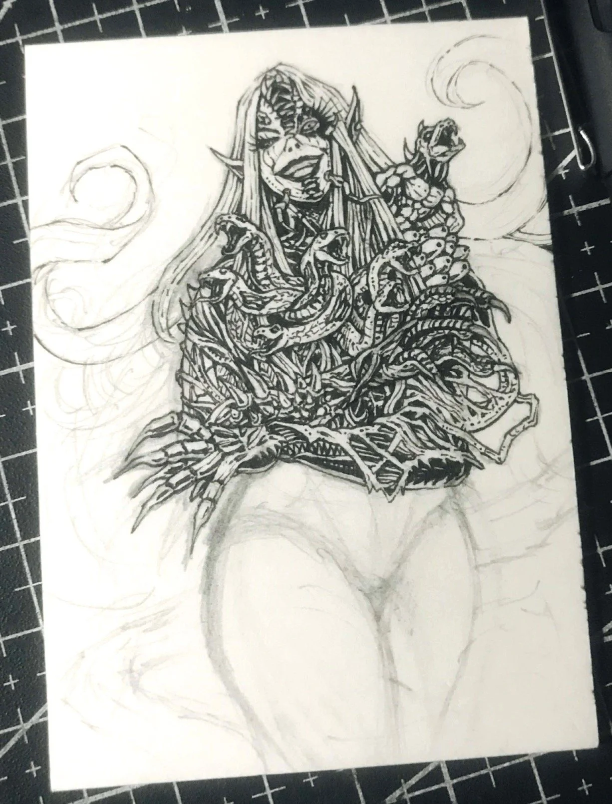 Poison Ivy, Absolute Batman sketch card. A detailed black-and-white drawing of a fantasy character with long hair, pointed ears, and various snakes intertwined around their body.