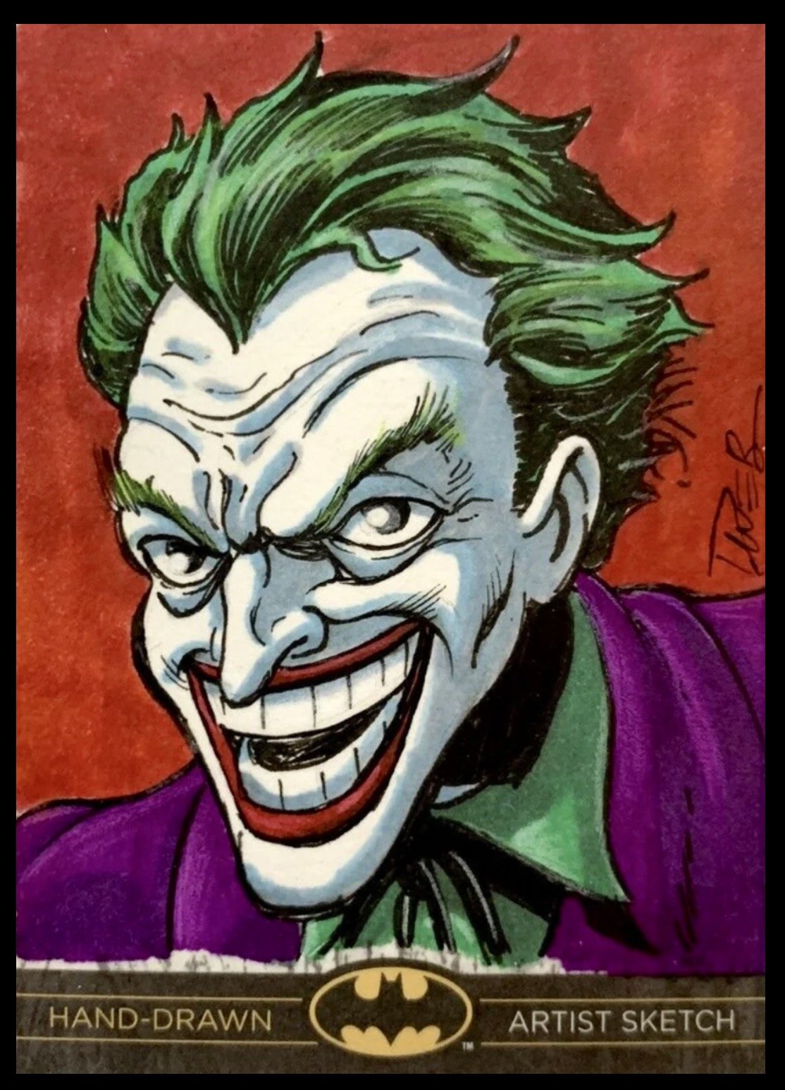 Batman legend sketch card. Hand-drawn illustration of the Joker, a comic book villain, with green hair, white face paint, red lips, and a purple suit, against a red background.