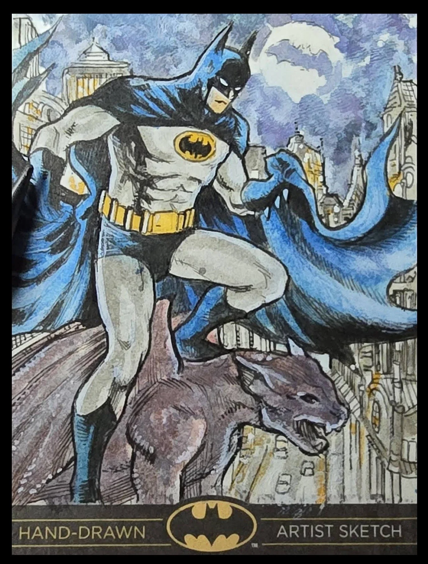 Batman Legend Sketch card, Hand-drawn Batman superhero in a cityscape, wearing his classic costume with a cape flowing, standing on a rooftop with a full moon in the background.
