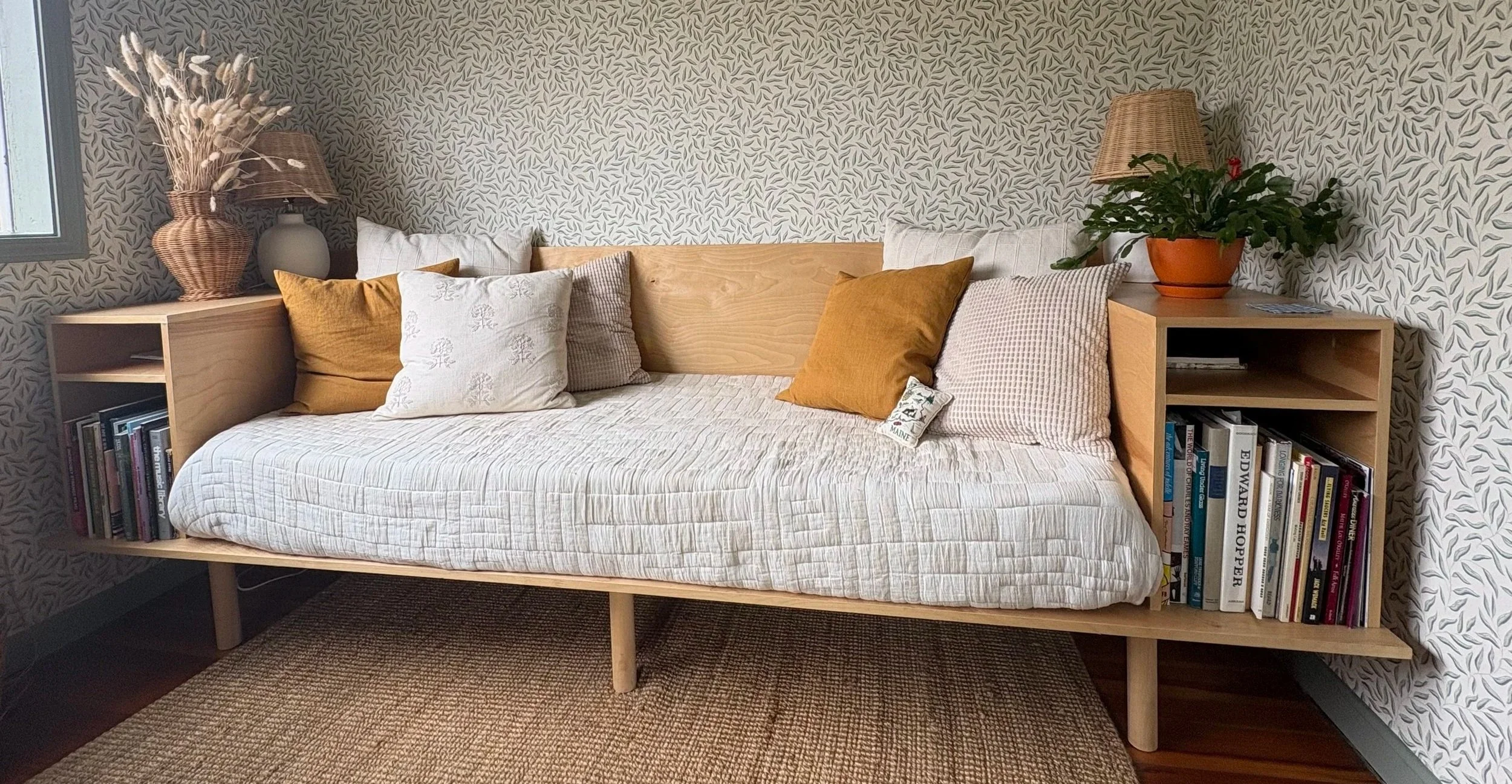 A custom-built daybed made of birch plywood on doweled legs. 
