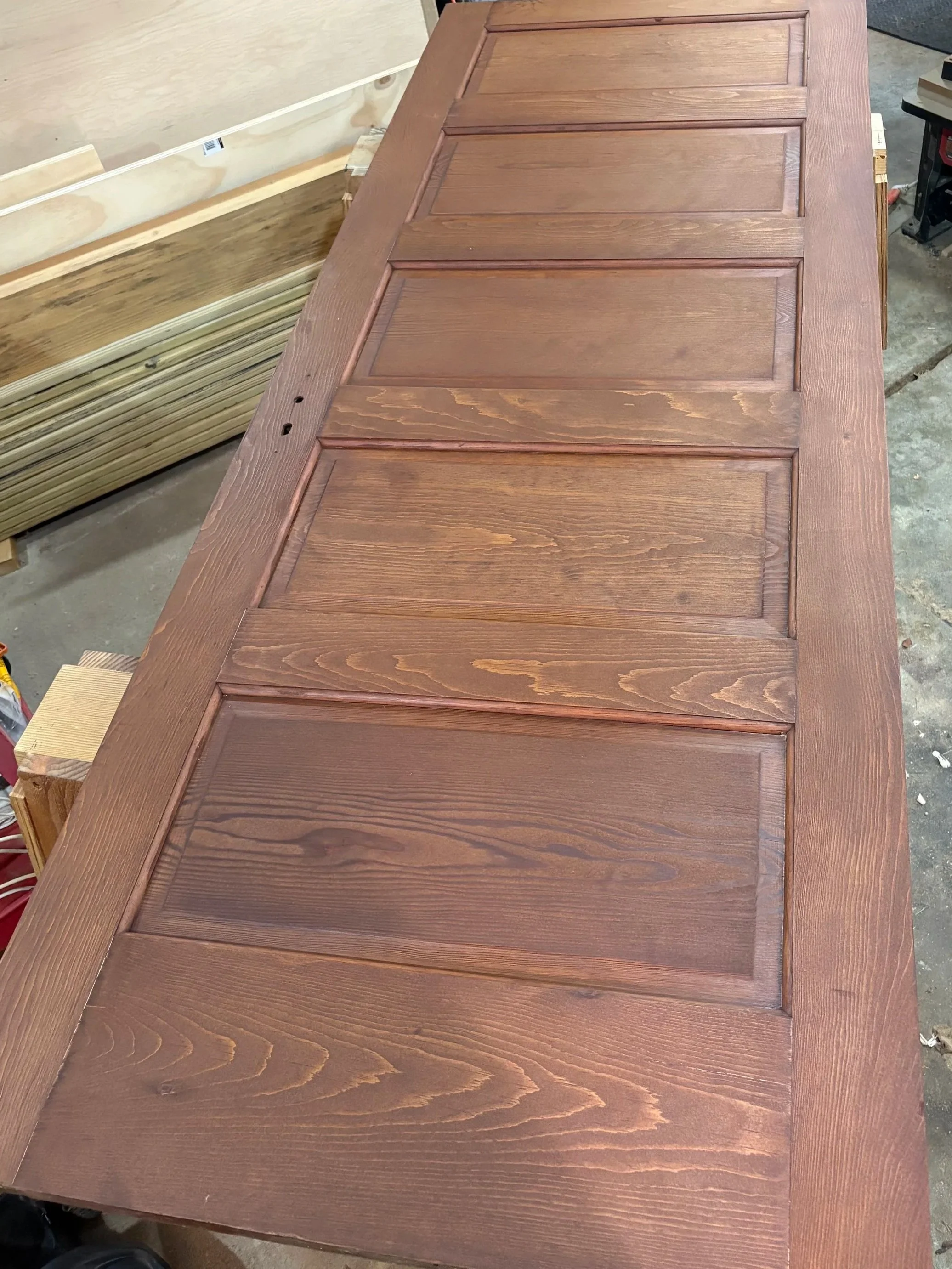 An old five panel door. Stain matched and tung oiled to perfection.
