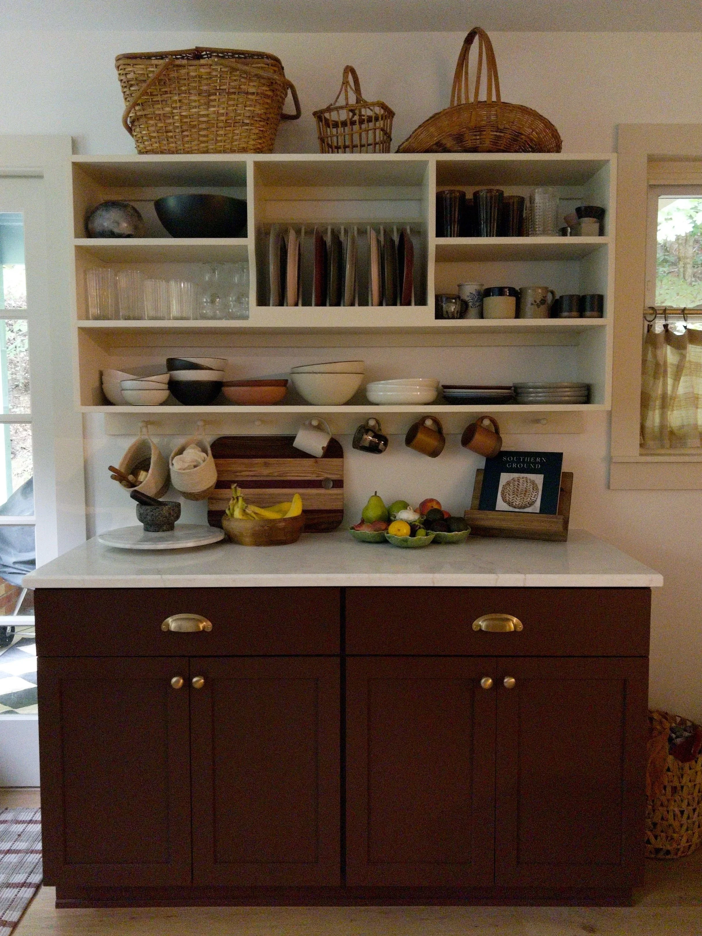 Solid pine cupboard with dish rack and shaker pegs.