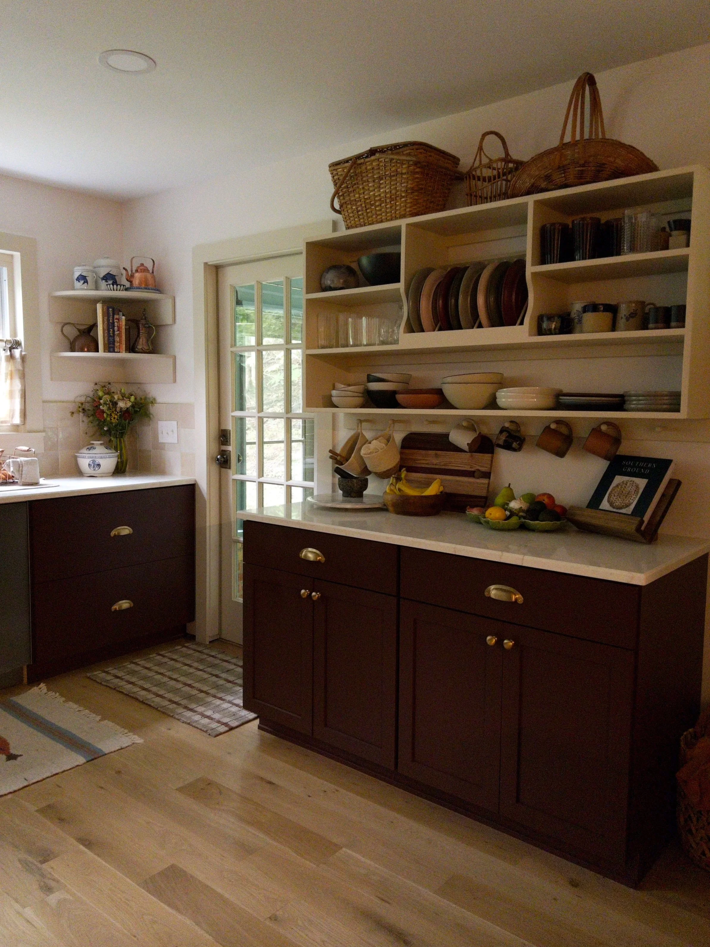 Custom designed and built cupboard and additional circular shelving. 