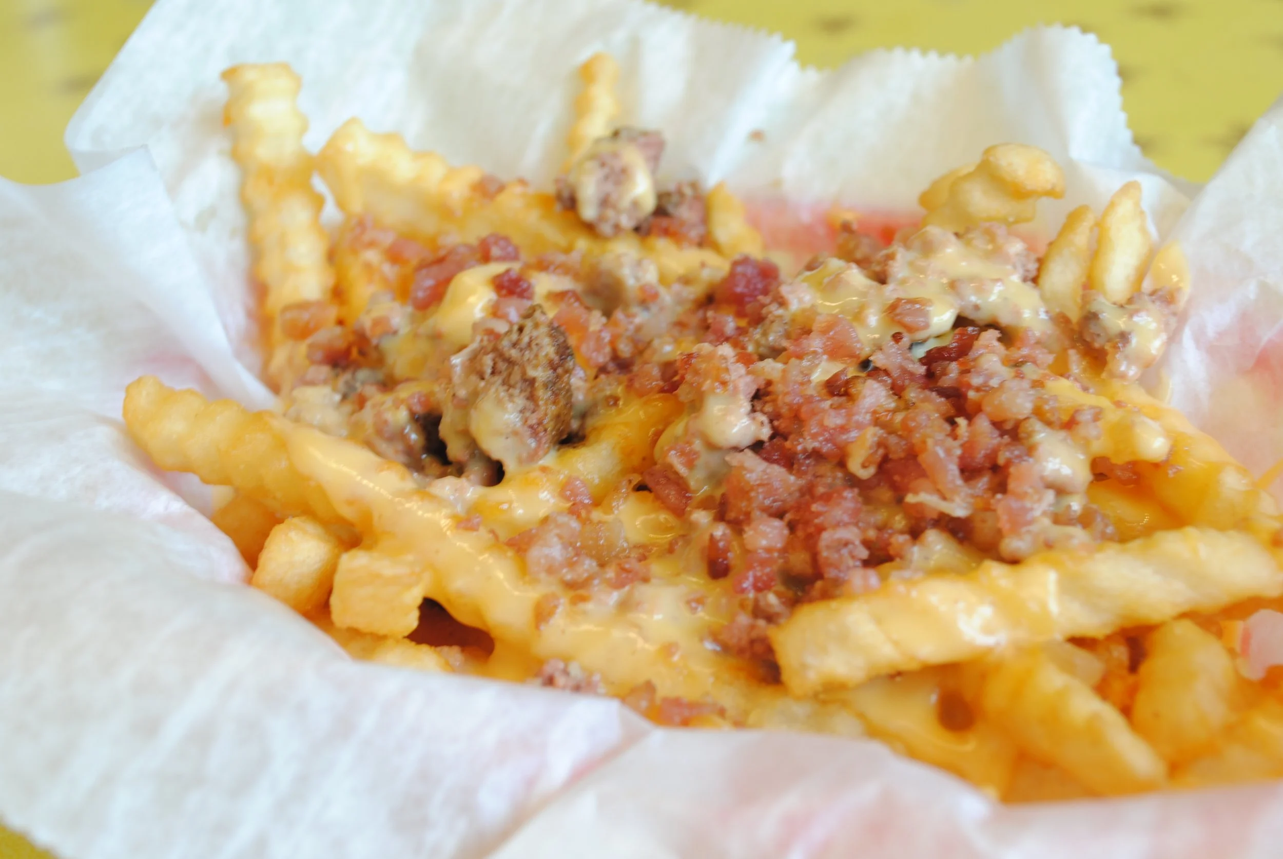 Bacon Cheeseburger Fries: Crinkle fries topped with burger crumbles, creamy cheese sauce and bacon.