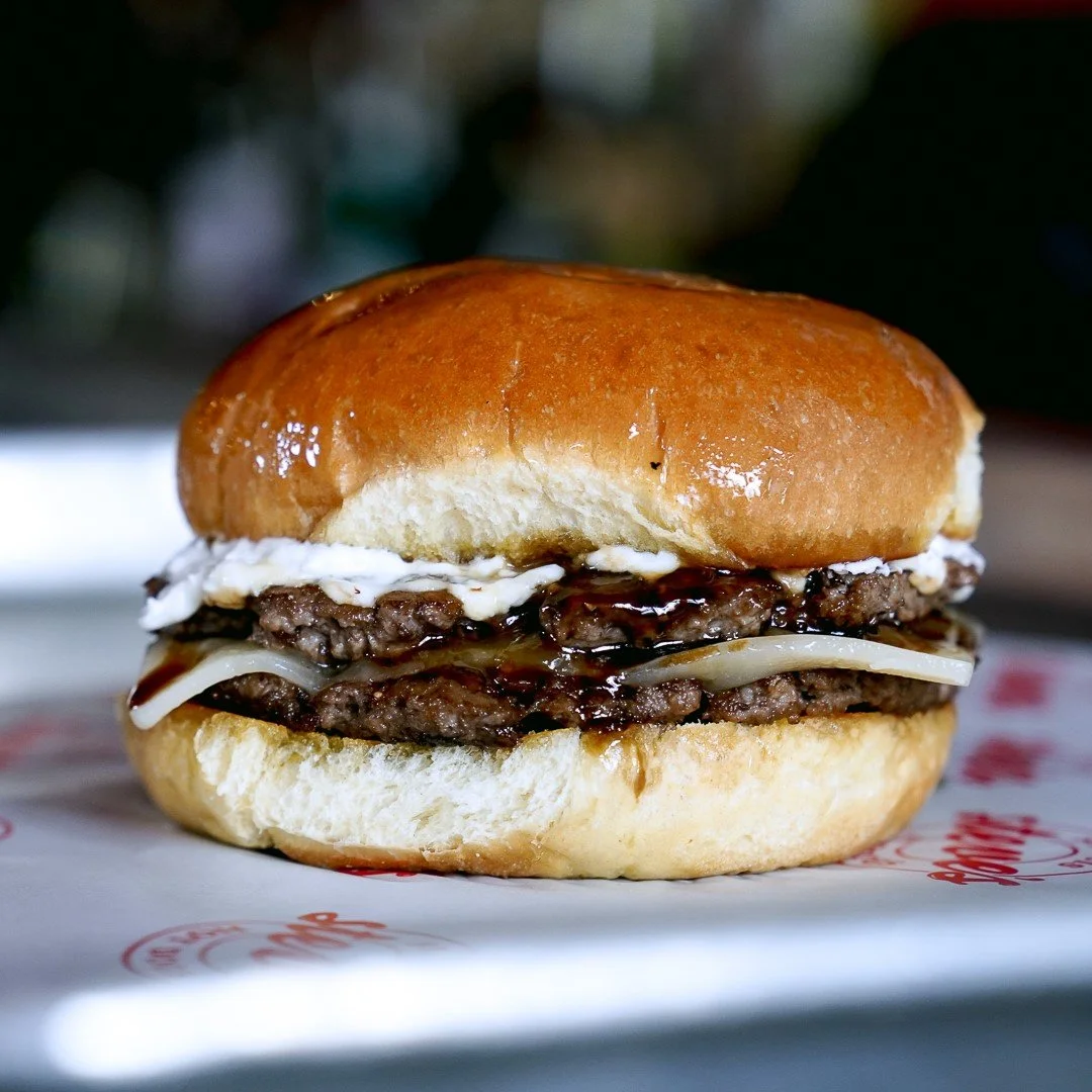 Figgy Stardust: A single smashburger patty, sweet fig jam, bacon, goat cheese spread, white cheddar and a drizzle of Balsamic glaze. 