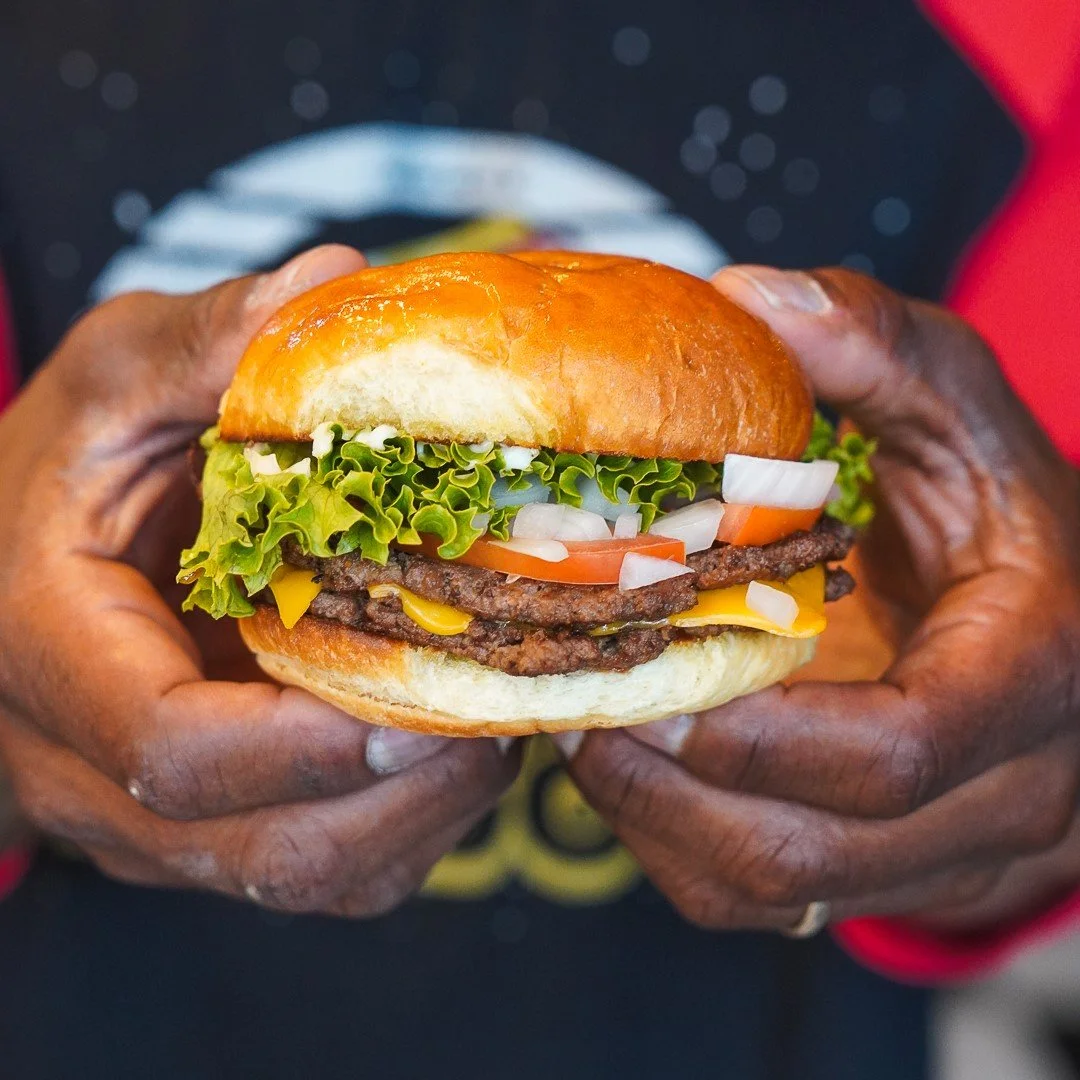 Hey Now You're An Allstar: A single Smashburger patty, loaded with American cheese, lettuce, tomato, raw onions, ketchup, mayo, and mustard.