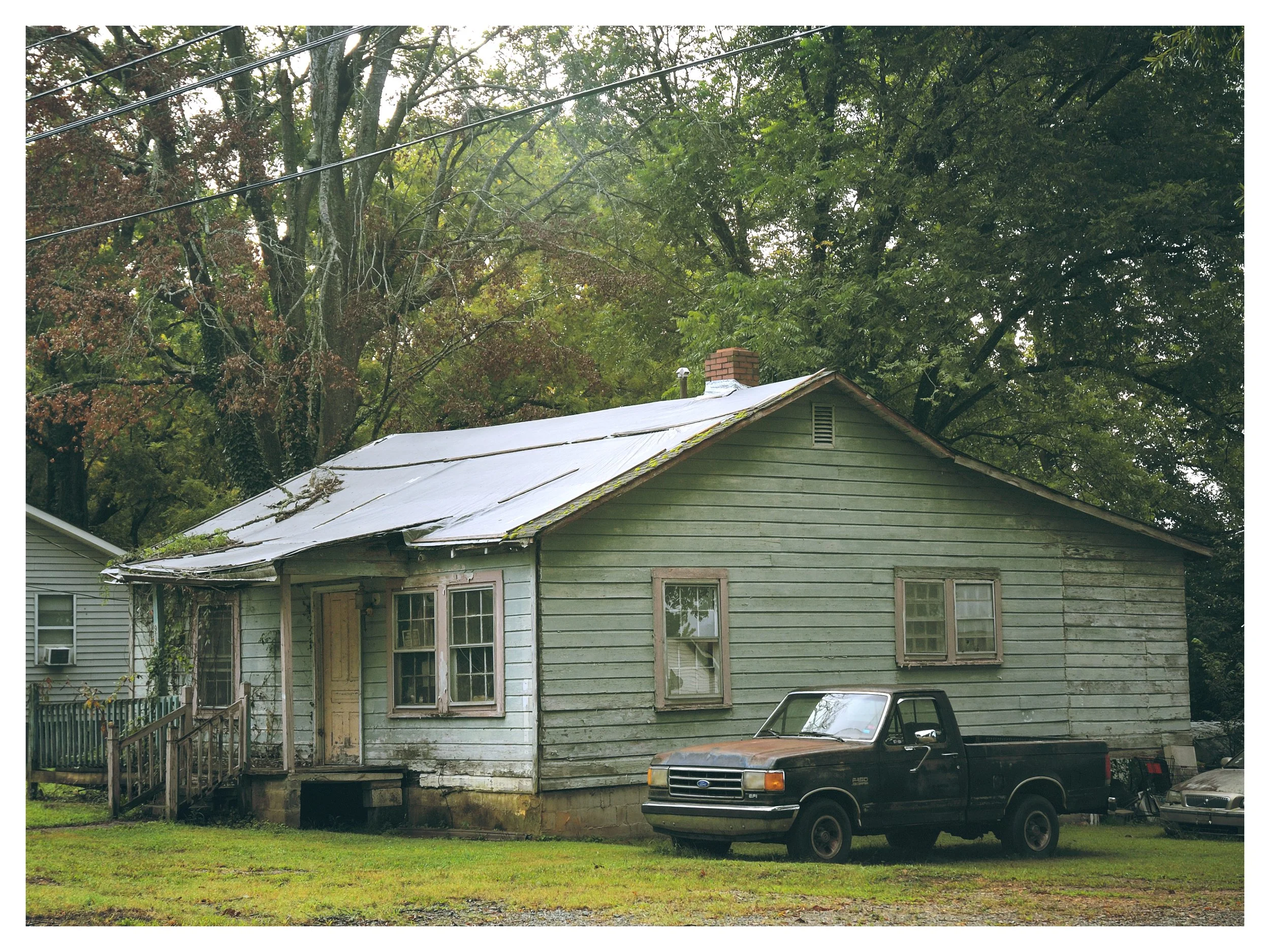 Old home and old truck.  Best of days behind them.  Why?