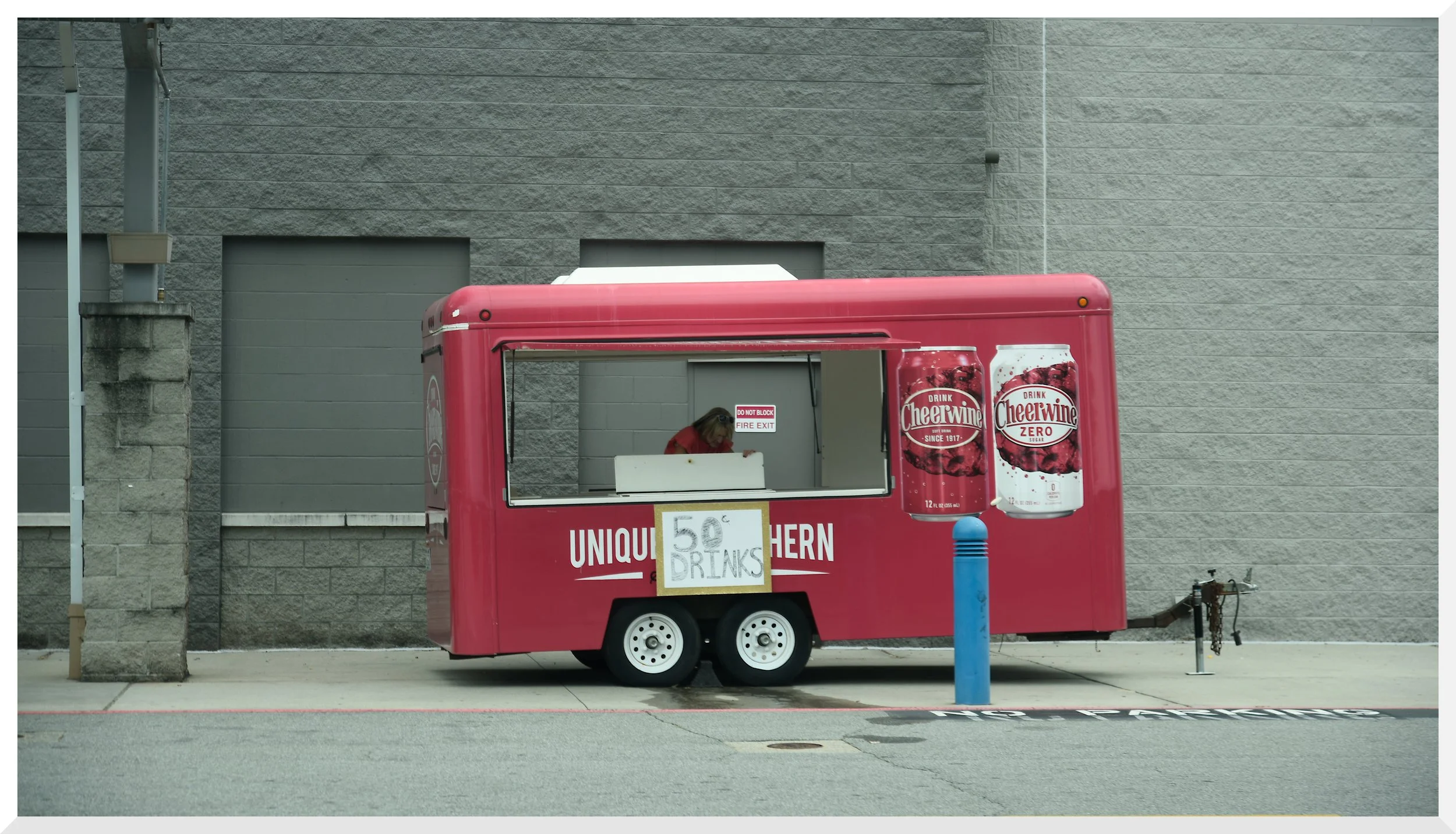 I looooooved this as soon as I saw it.  The red trailer, blue post and gray background. Kind of minimalist and has a weird 2D effect, kind of flat.  There was a car show about to start and folks were getting ready.  ALWAYS carry a camera.