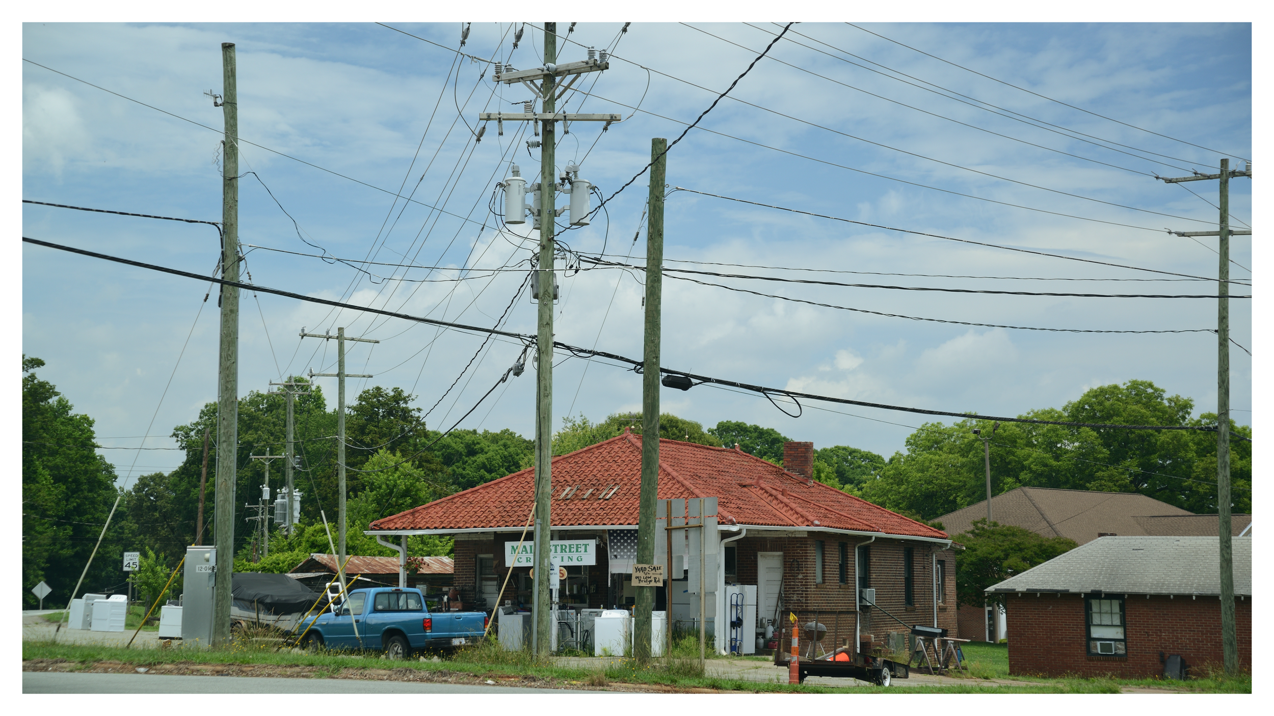 Intersection at 27 & 150 - love the mix of wires and poles, they're everywhere.