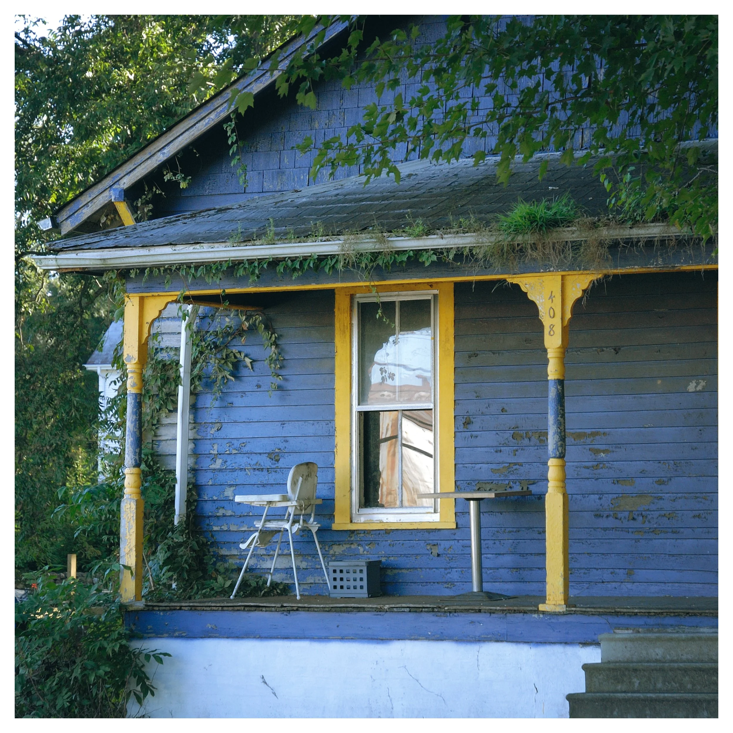 This is one of the saddest photo I have taken.  Home is abandoned and there is a high chair left on the porch.  Makes you wonder what happened.  Seems like that chair should have a baby in it.  