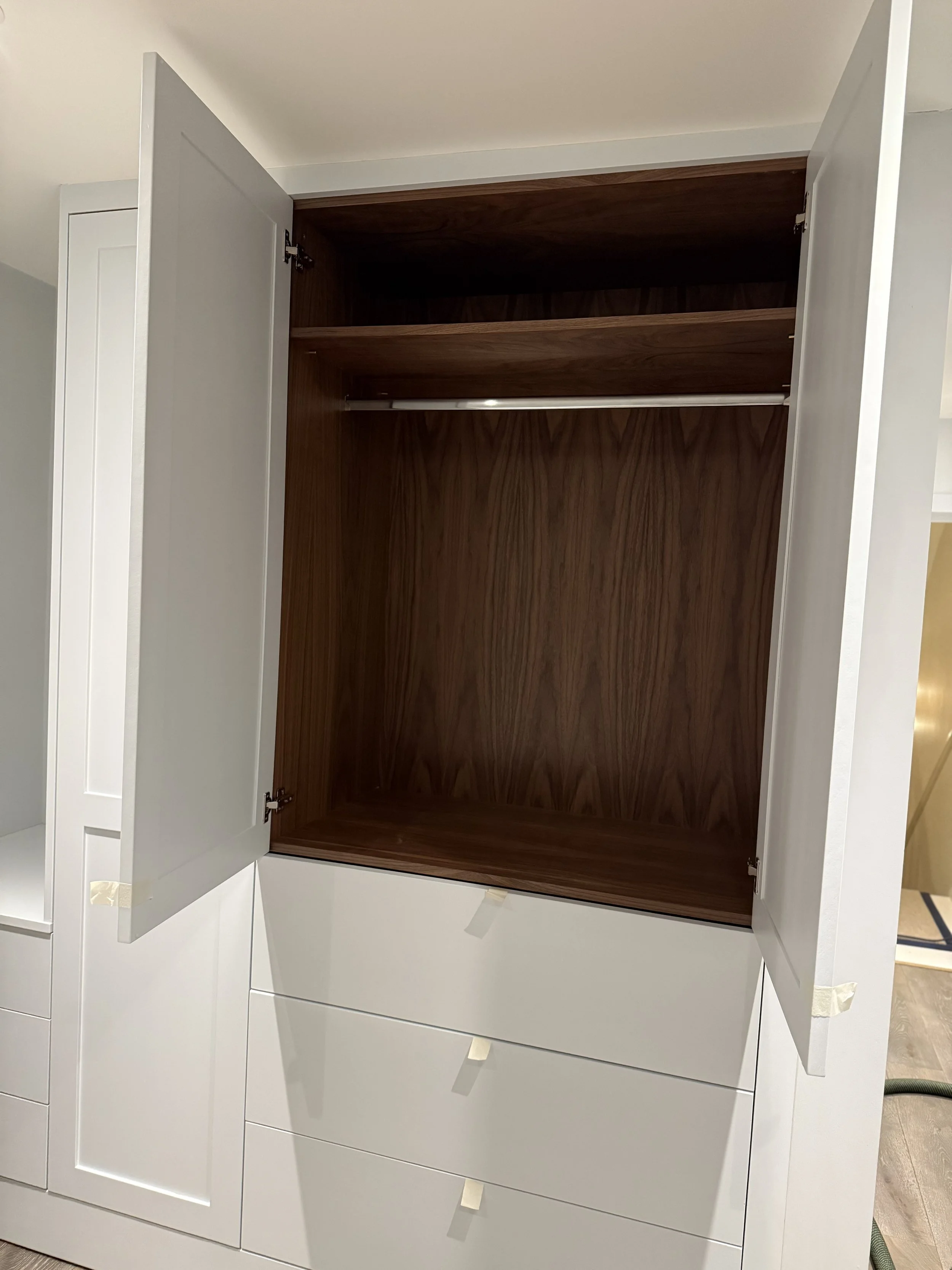 Premium built-in white Shaker wardrobes with walnut veneer carcass