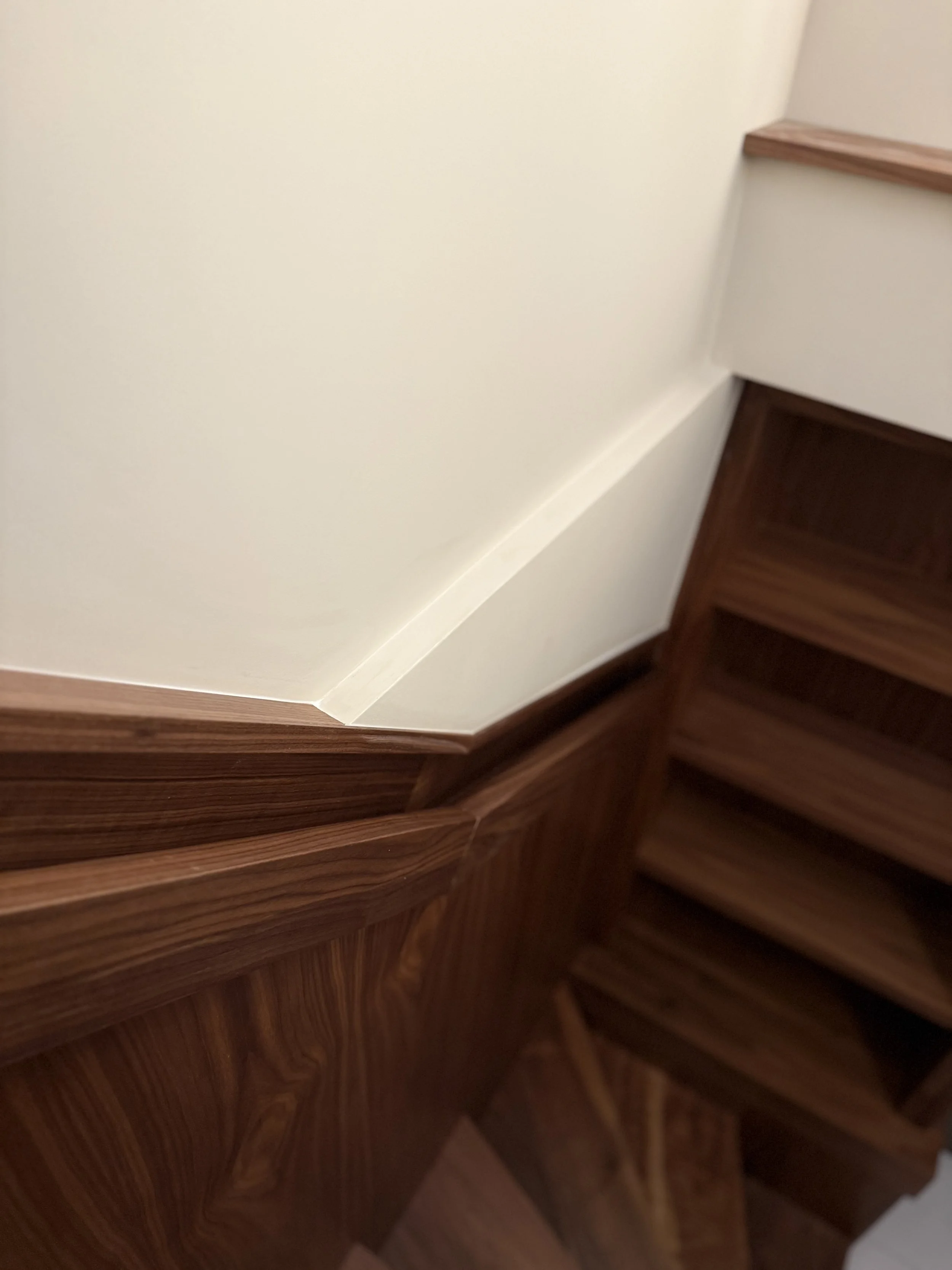 Bespoke open-tread walnut staircase manufacturer London Ken Pope Custom Joinery