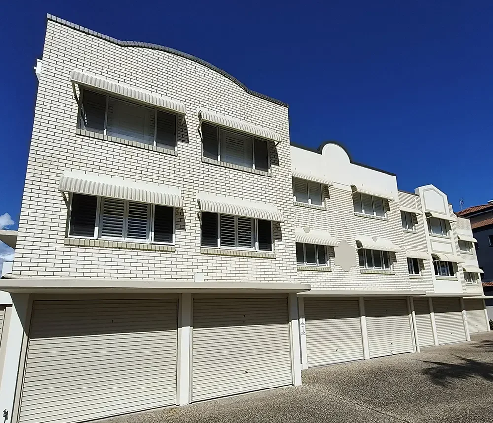 Classic 1980s brick units in Mooloolaba. Colour scheme embraces the existing brick with a contemporary version of retro, allowing the unique style of the property to shine.