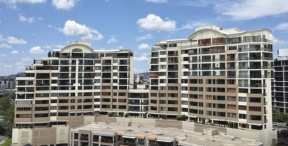 Iconic residential property on the Brisbane River, in a colour design that modernises the original "Tuscan" look of Brisbane's 1990s developments.