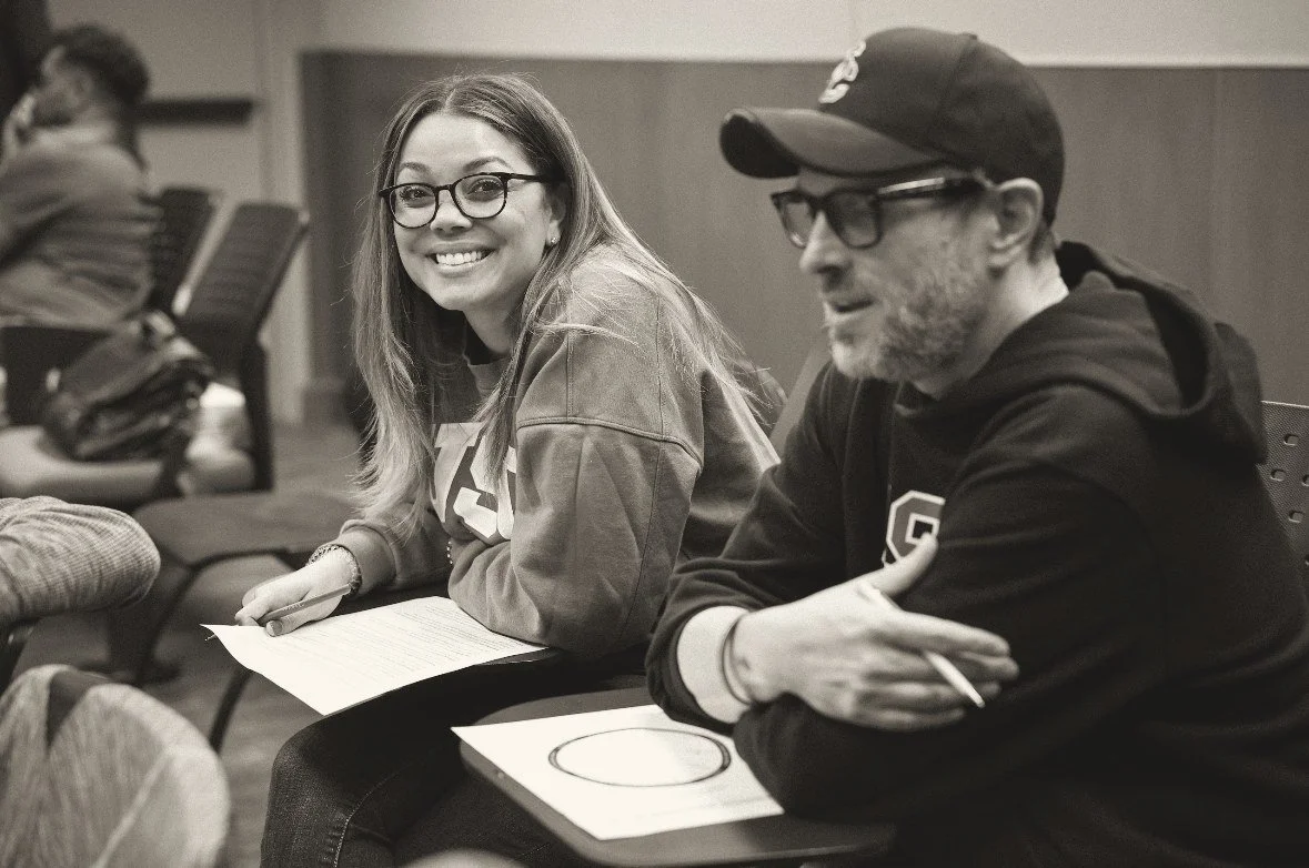 Olivia Brice smiling during a working session with a colleague