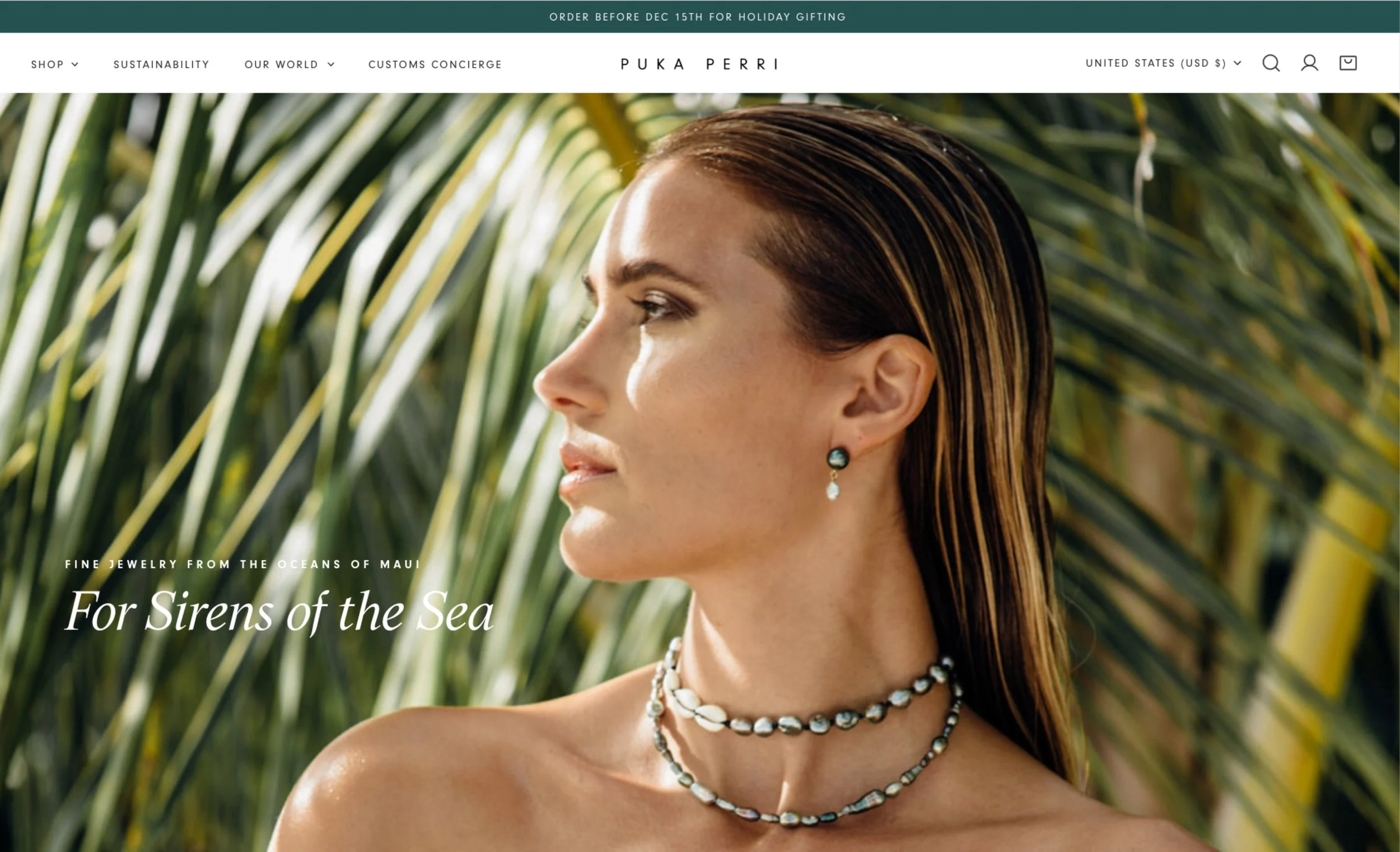 Thumbnail of Puka Perri Shopify website showing a profile of a woman with wet hair wearing shell jewelry, standing outdoors with green palm leaves in the background.