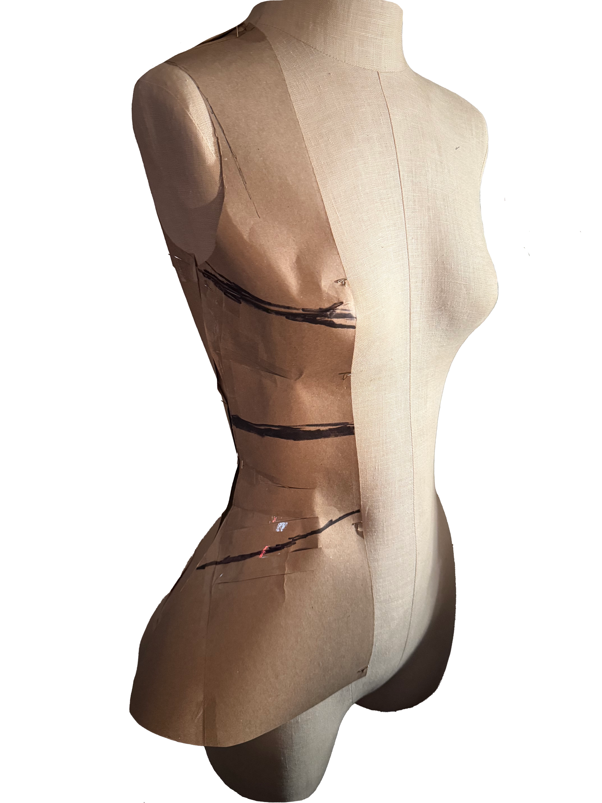 A beige dress form mannequin with a fabric cover displaying a fitted dress pattern on its torso. The pattern includes black tape marks and guidelines for garment construction.