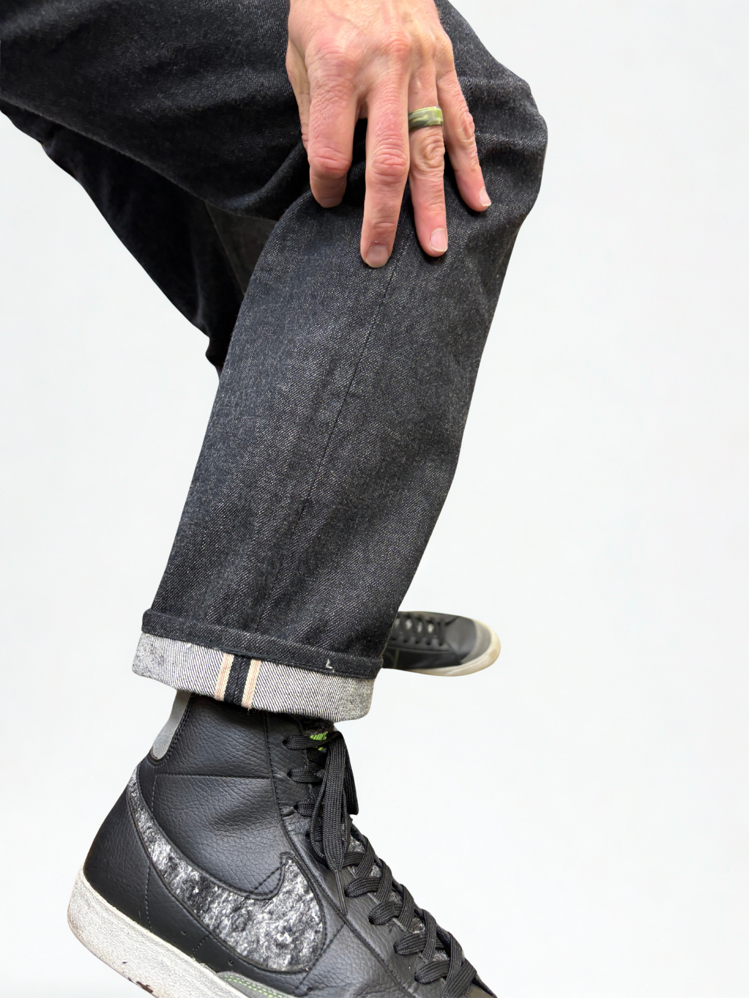 Close-up of a jean hem alteration preserving the original selvage seam, showcasing Viking's tailoring craftsmanship