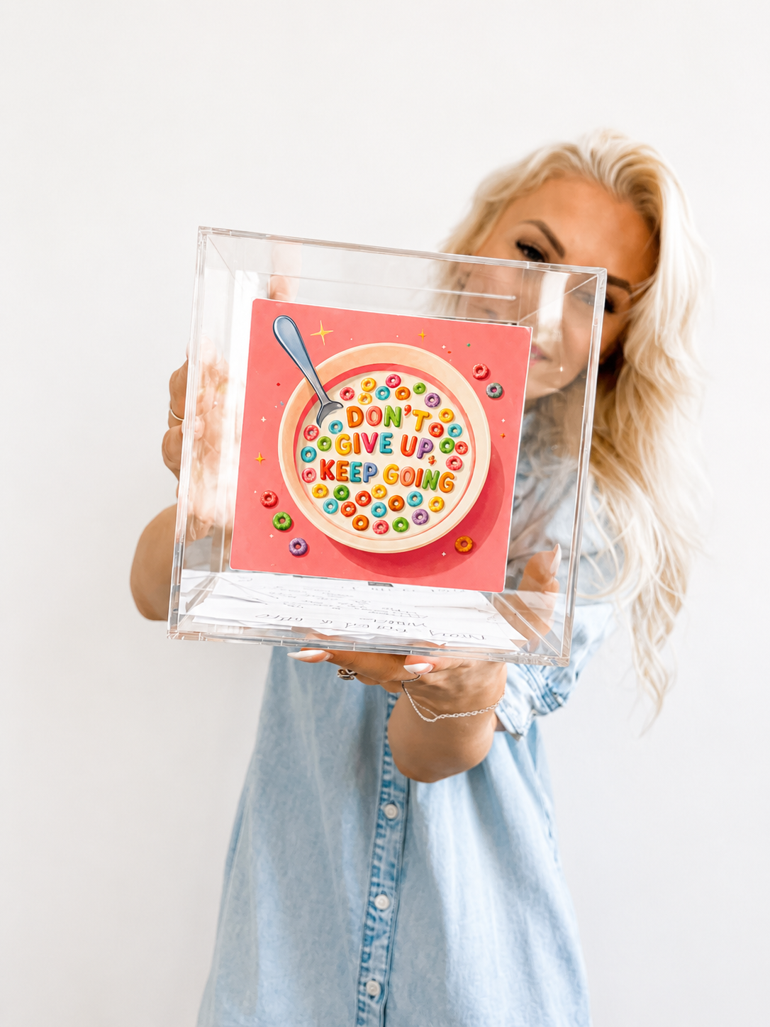 Lauren Stewart holding the Don't Give Up Keep Going cereal sticker — Project Love My Life Again motivational sticker collection