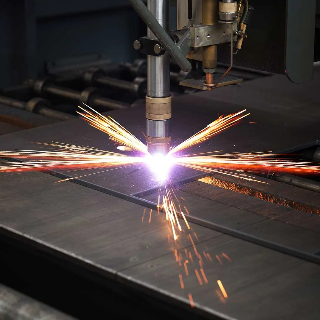 A welding machine is welding steel with sparks flying.