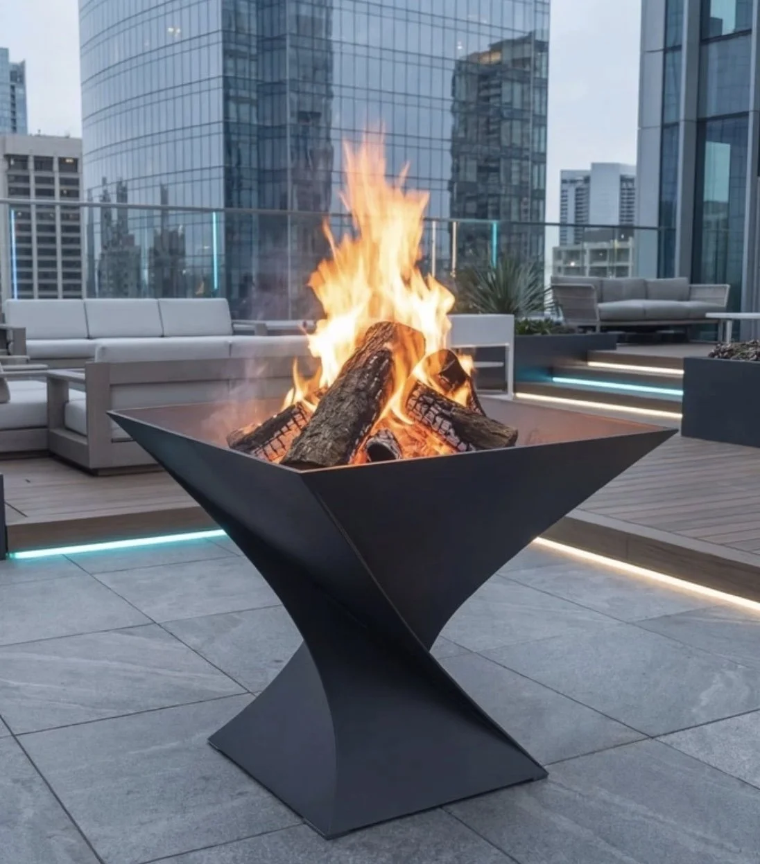 A modern outdoor rooftop patio with fire pit, surrounding contemporary seating and city skyscrapers in the background.