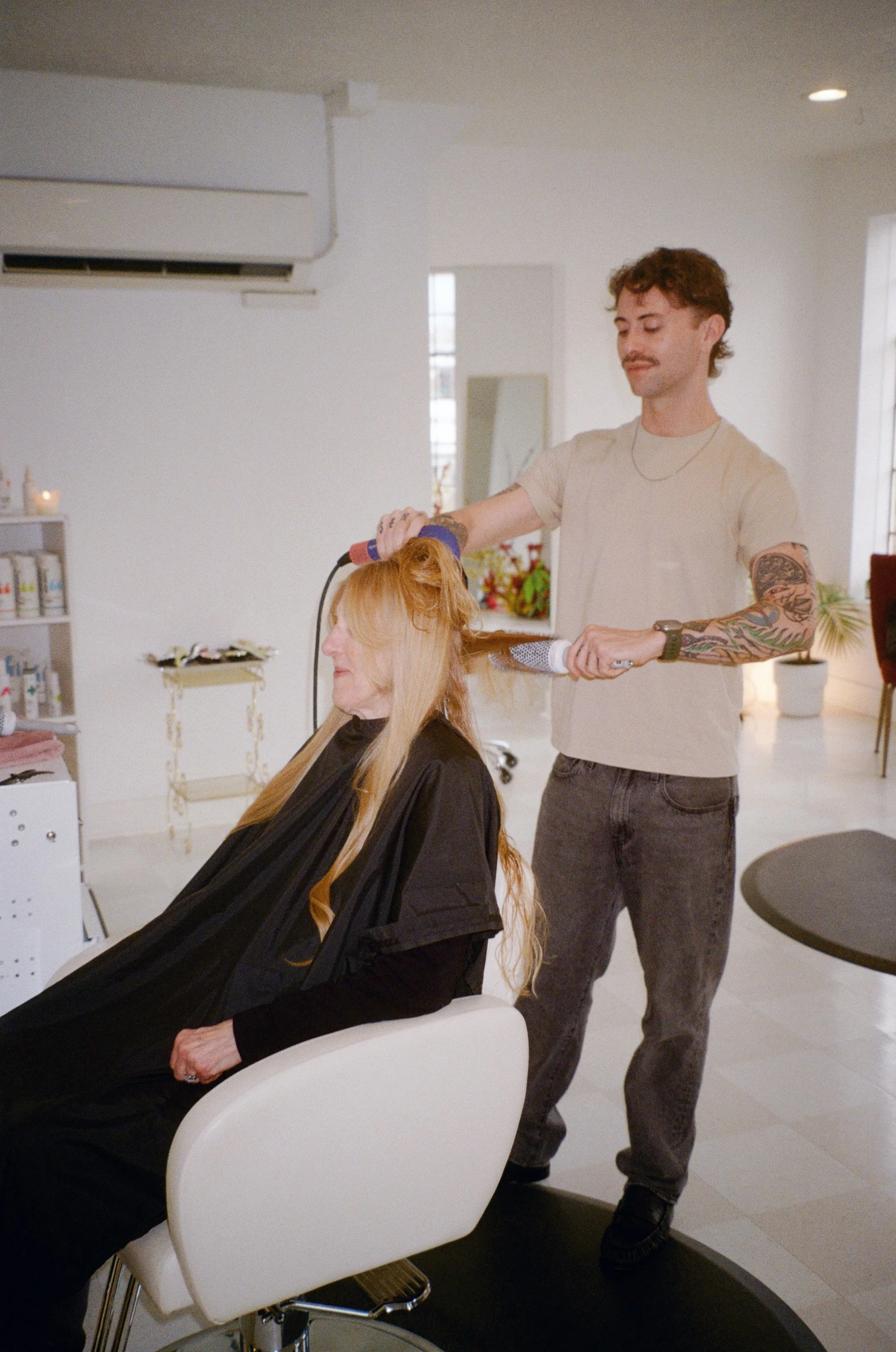 Zack Grenon doing hair at Hedon HQ in Portland, Oregon