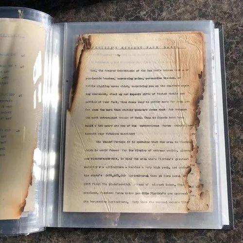 burned letter in a plastic protective sleeve