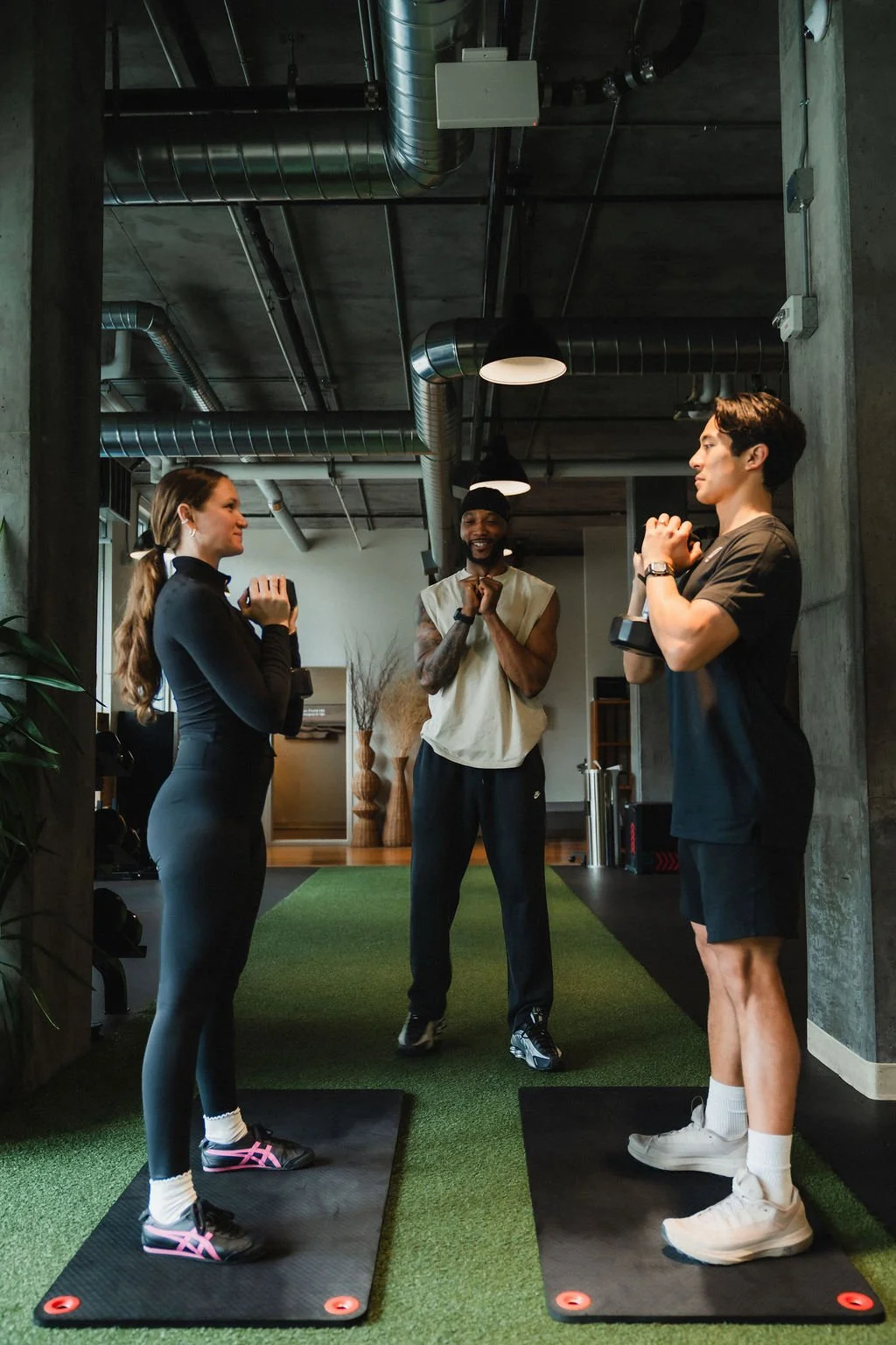 Coach Elijah Lucy of Body Profit Fitness Personal Training A Male and Female Client