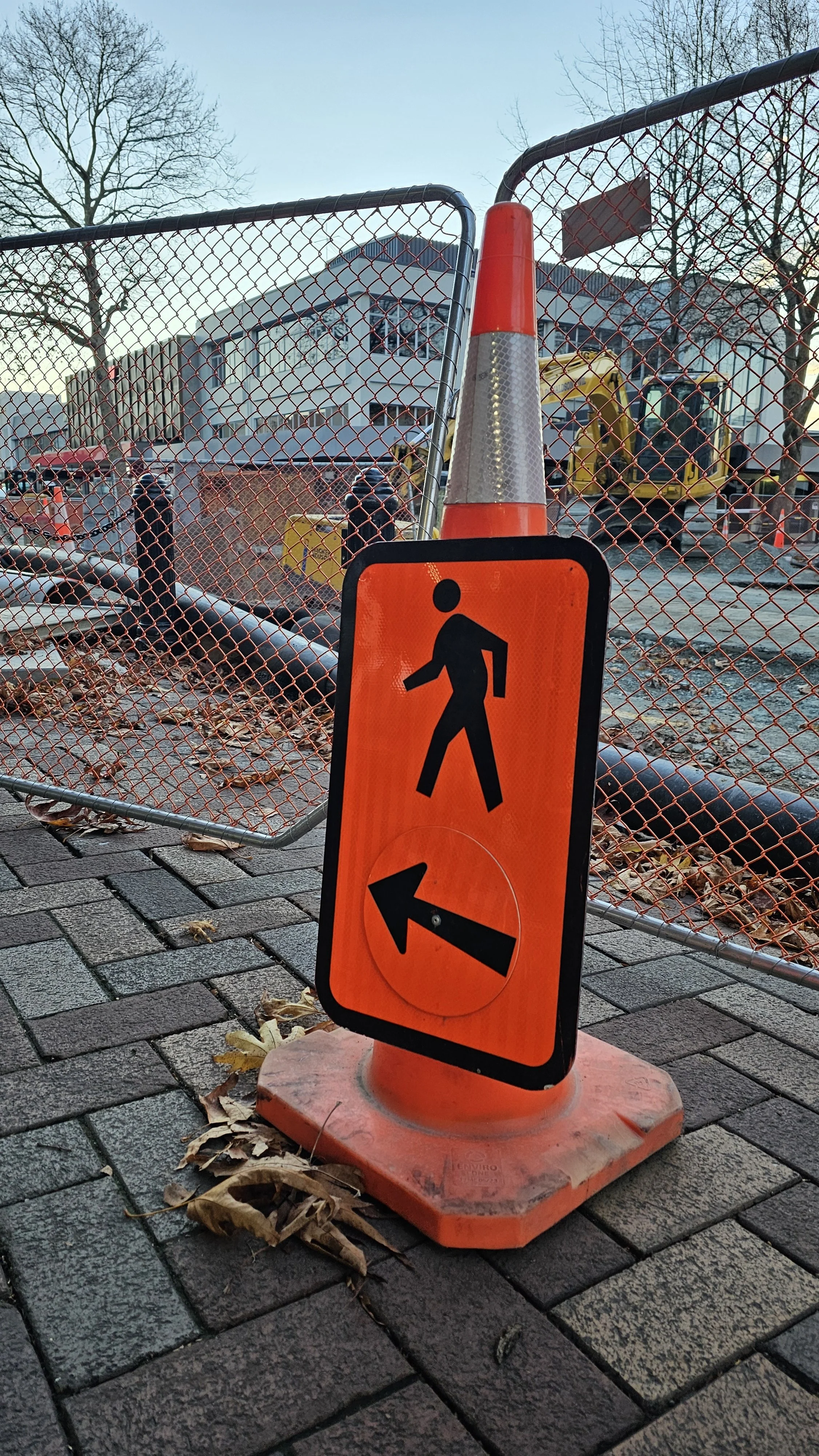 Roadworks with a pedestrian detour sign, representing practical Health & Safety in a work environment.