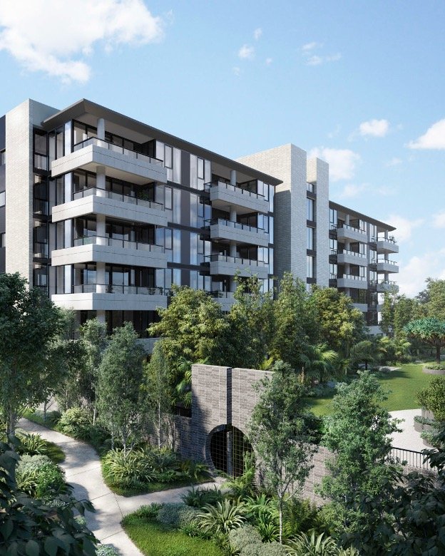 Modern multi-story residential building surrounded by lush greenery and a landscaped garden with pathways.
