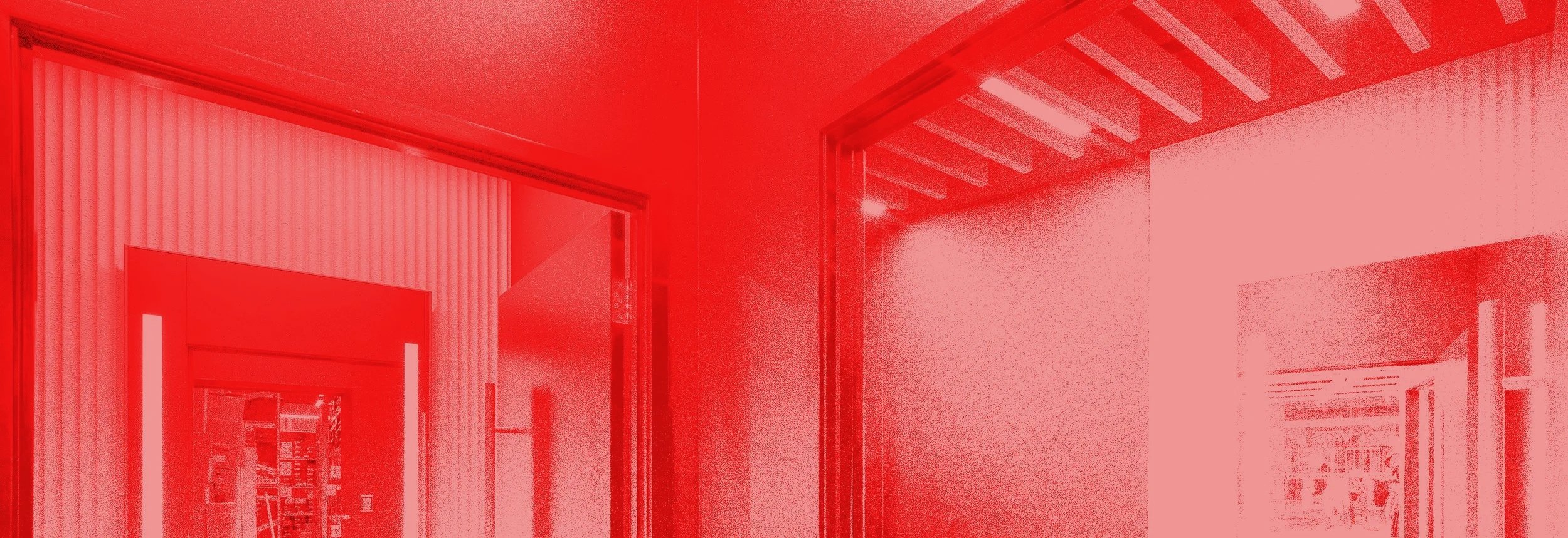 Interior view of a building with open doorways and visible ceilings, colored in red.