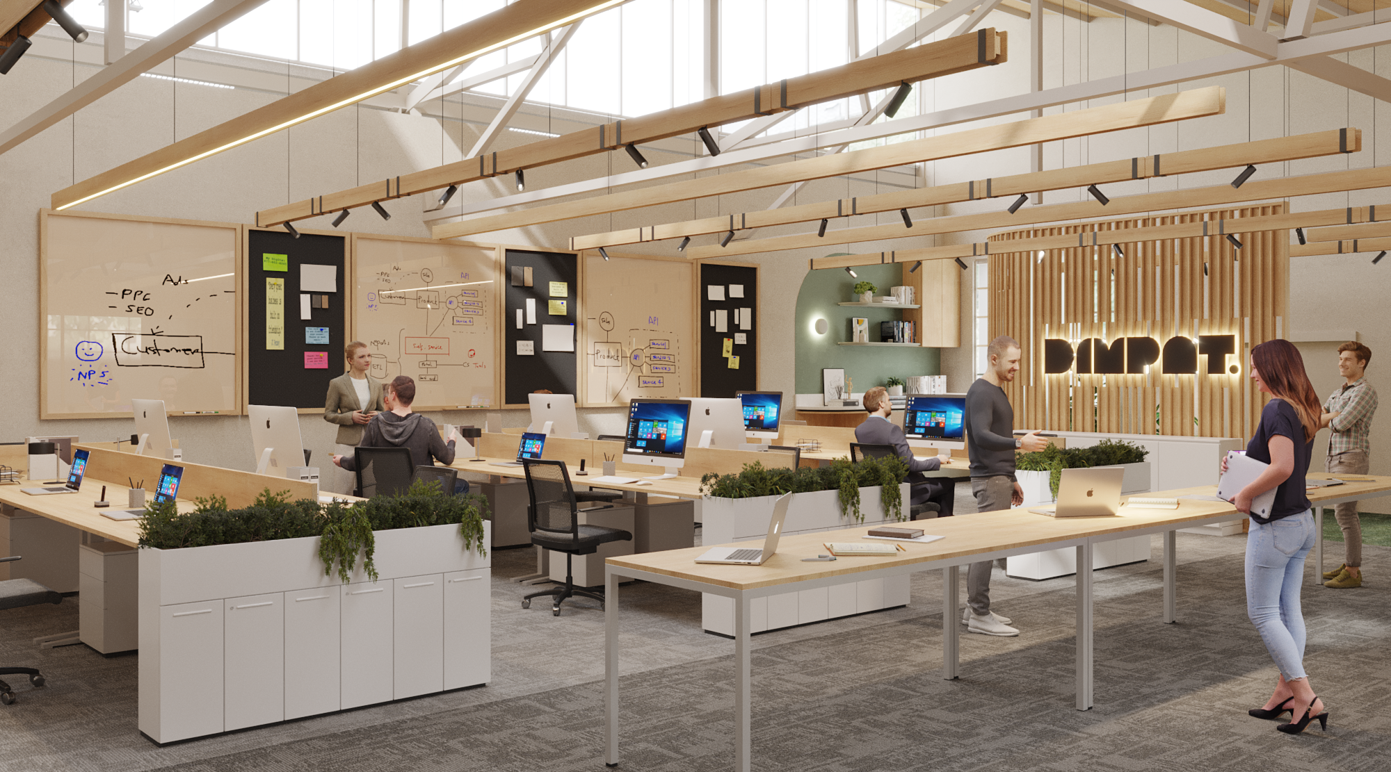 Modern open-plan office with multiple workstations, people working and talking, whiteboards with diagrams, and a large illuminated sign on a wooden slat wall.