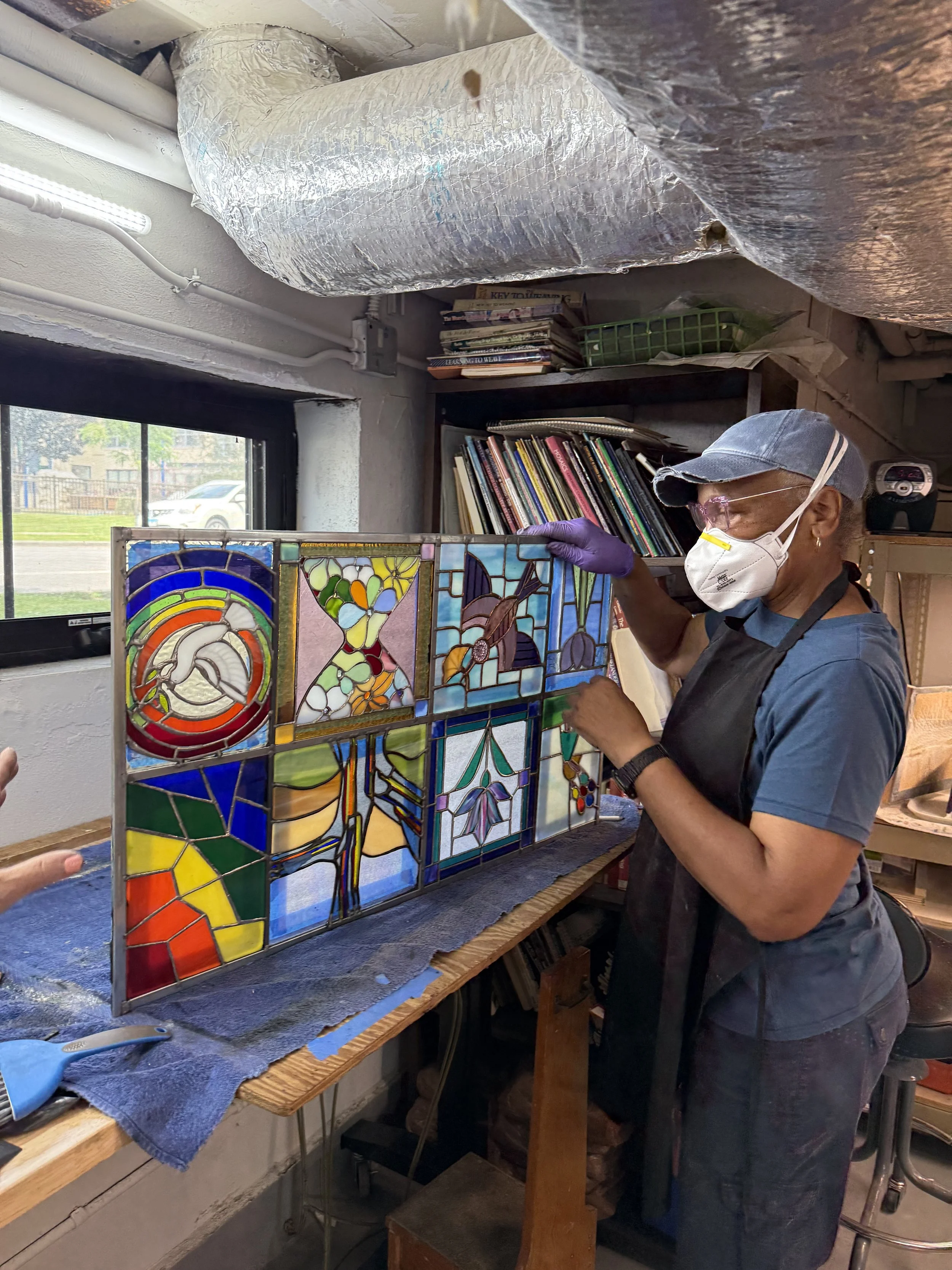 Advanced student cementing a panel of our collaborative window