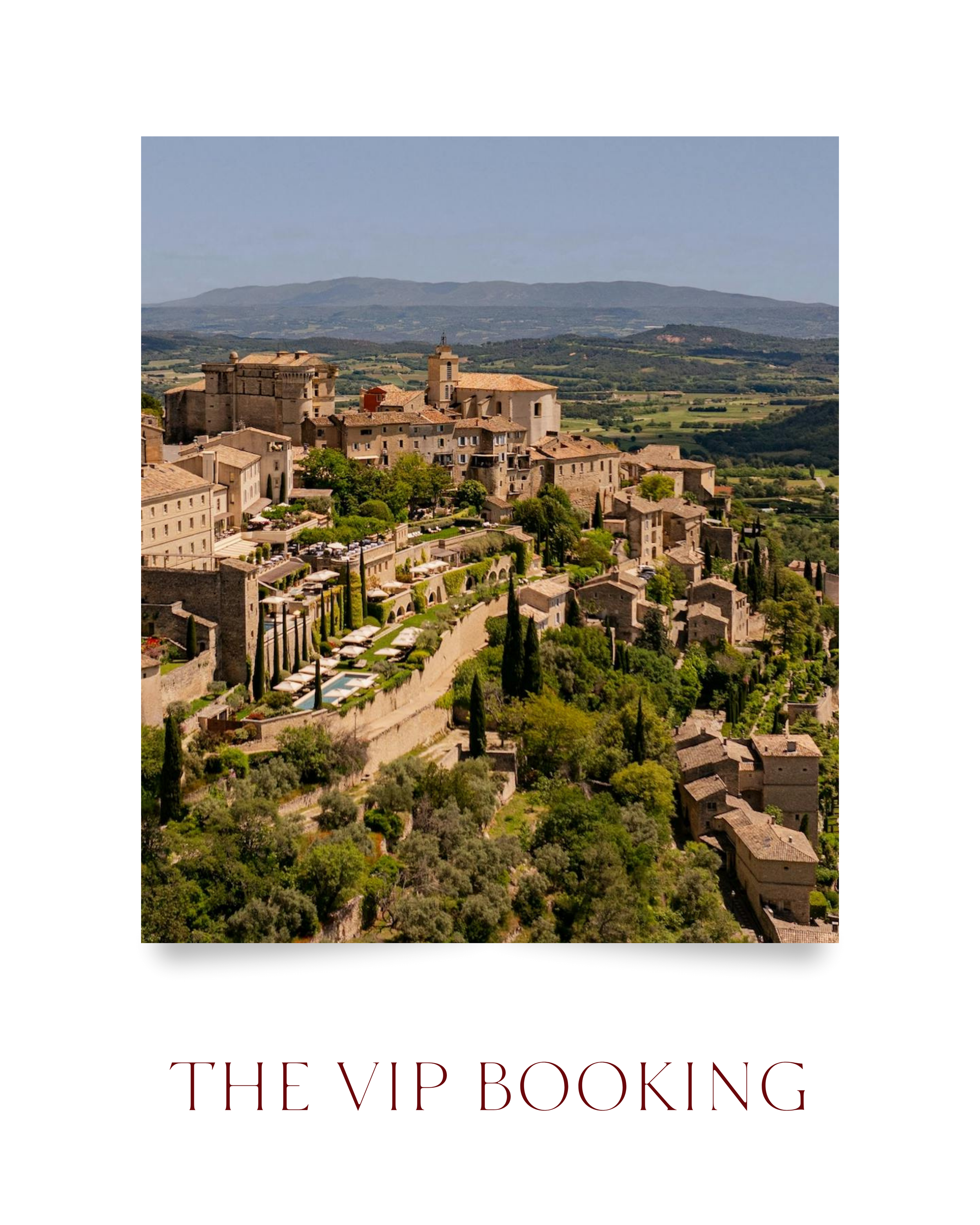 A scenic view of a historical Italian village with stone buildings, red-tiled roofs, and lush green trees, set against rolling hills and mountains in the background. Below the image, the text reads 'THE VIP BOOKING' in elegant maroon font.