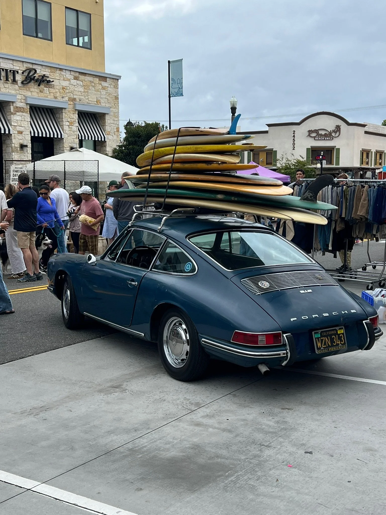Vintage Porsche with surfboards in a Southern California coastal neighborhood