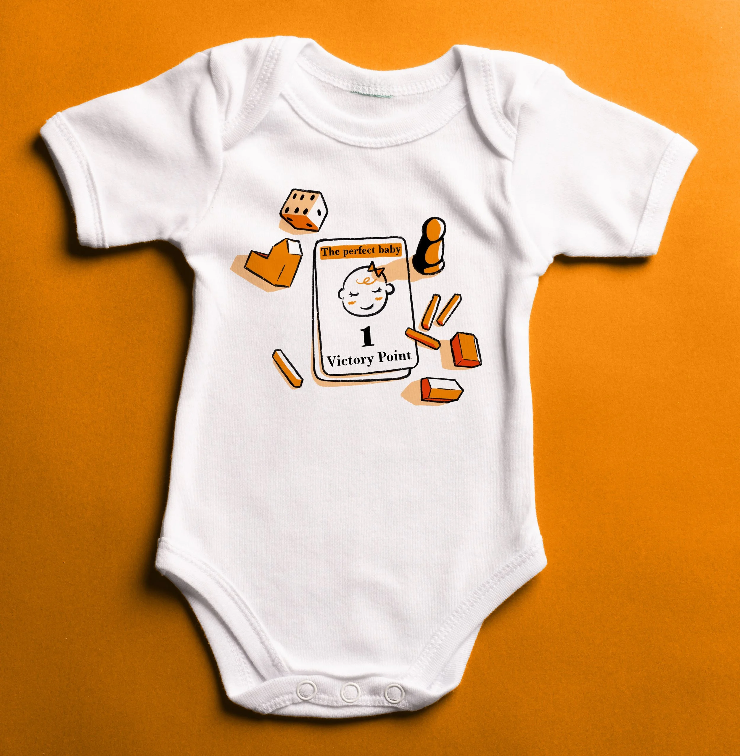 White baby onesie with a printed design, laid flat on an orange background.