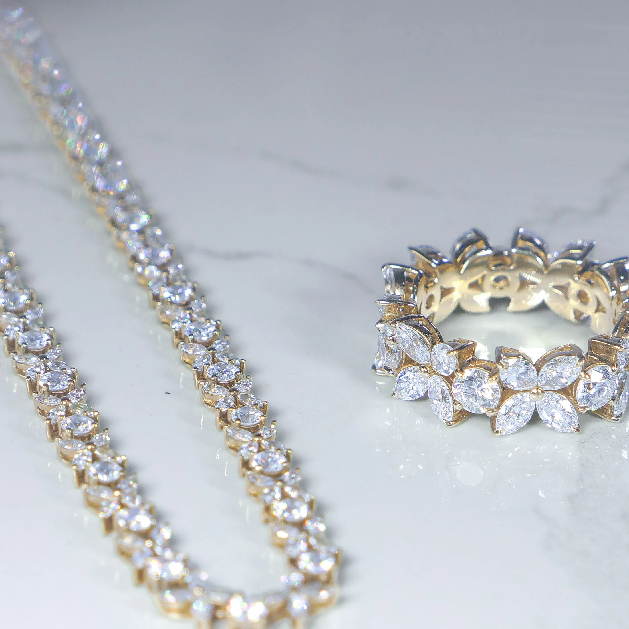 Marquise diamond band ring styled with a diamond tennis chain