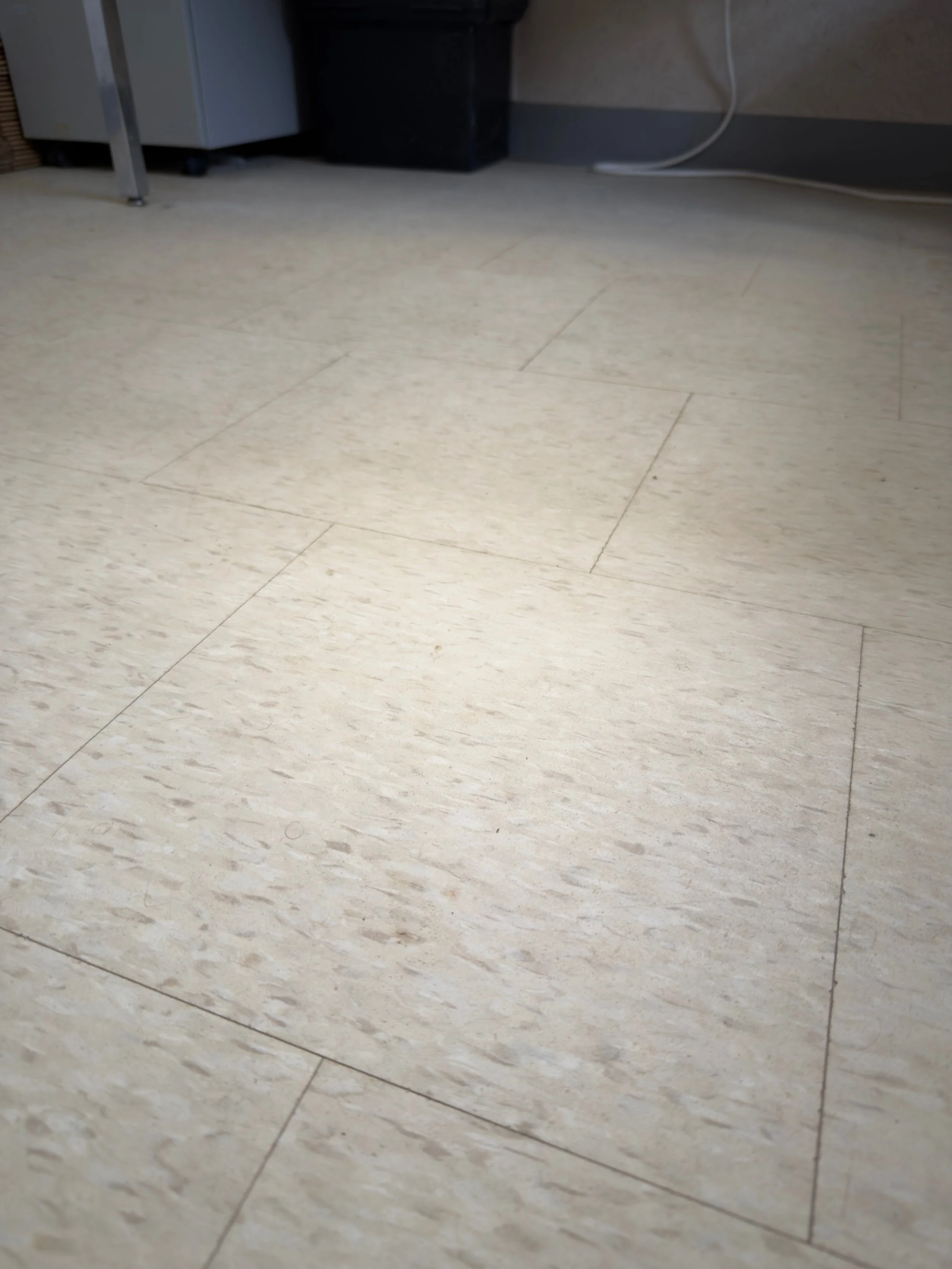 End result of a commercial VCT floor stripping and deep cleaning process, revealing a bright, stain-free office floor surface at Duke Energy.⁠