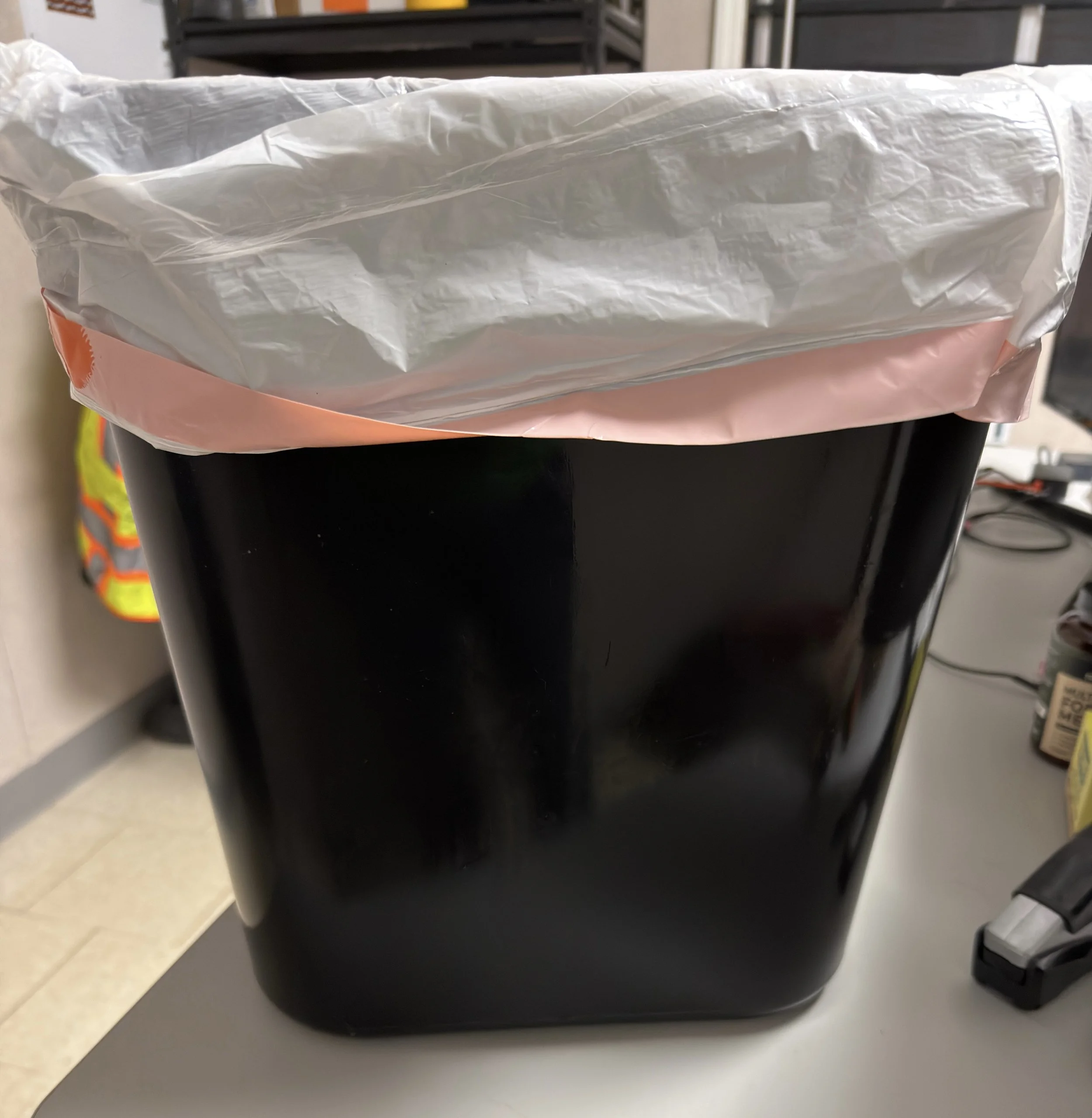 A freshly washed, polished, and lined black office trash receptacle, illustrating precision detailing during a Duke Energy commercial office cleaning.⁠