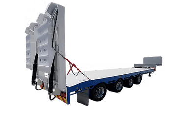 A flatbed trailer with a large, white, industrial machine secured on it.
