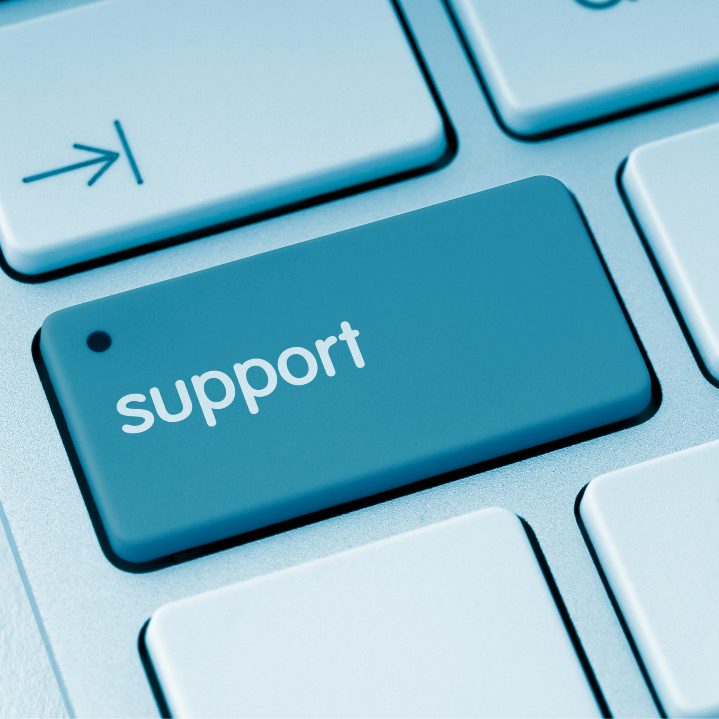 Close-up of a computer keyboard key with a support arrow icon and the word support.