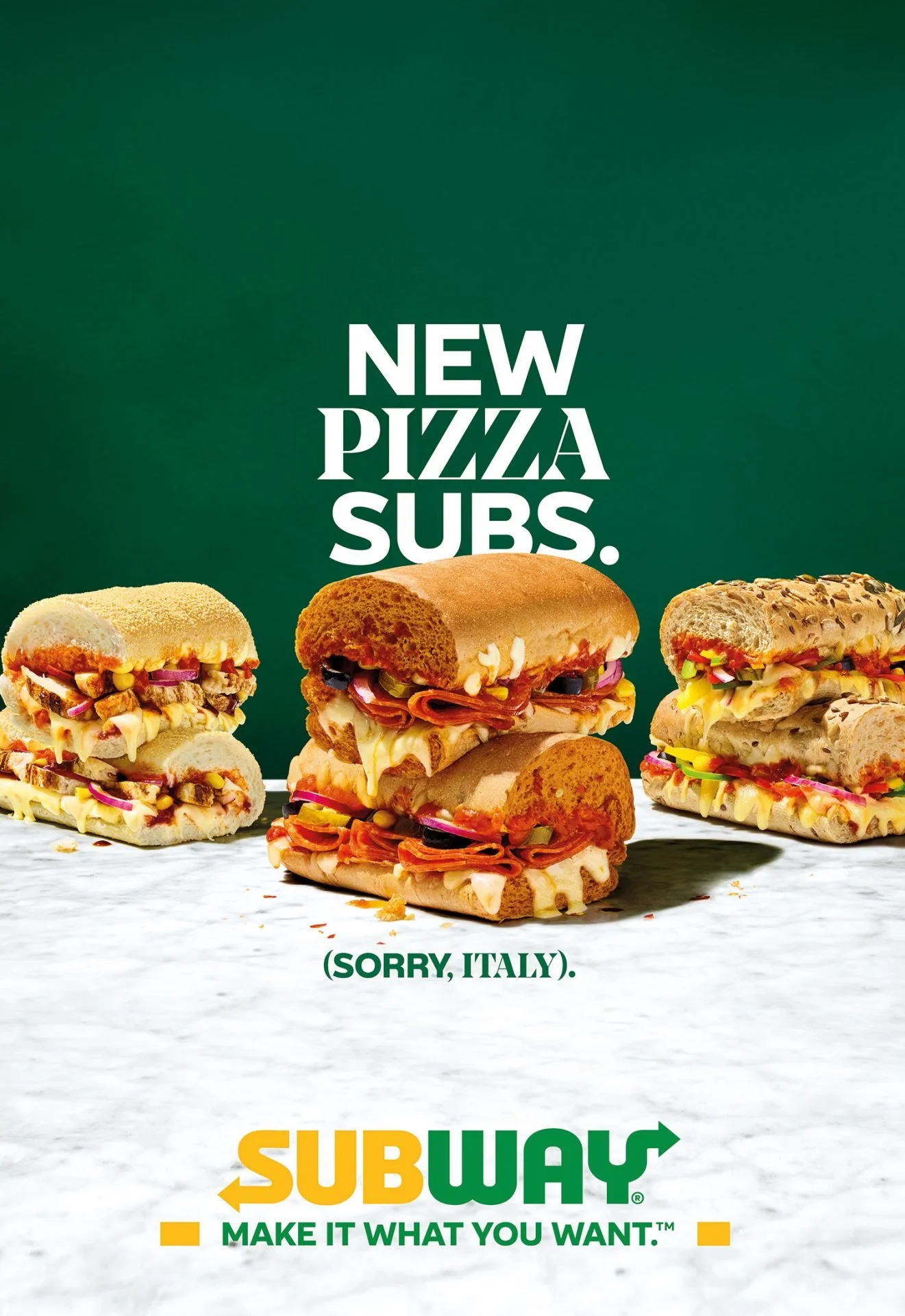 An advertisement showing various subs with different fillings and toppings under the text 'New Pizza Subs' and 'Sorry, Italy.' at the bottom, and the Subway logo with the slogan 'Make it what you want.'